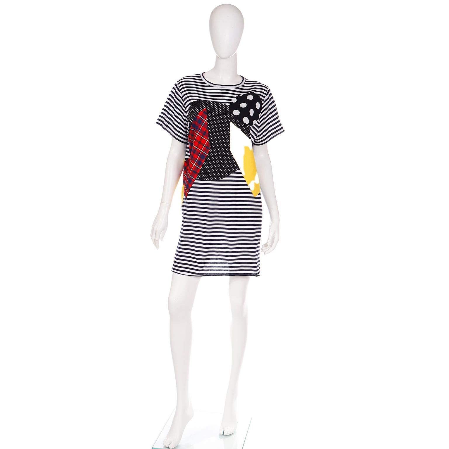 We love the Junya Watanabe designs for Comme des Garcons, and this colorful patchwork print cotton t-shirt dress would be such a fun addition to any summer wardrobe! This dress is easy to wear and the navy and white stripe background provides the