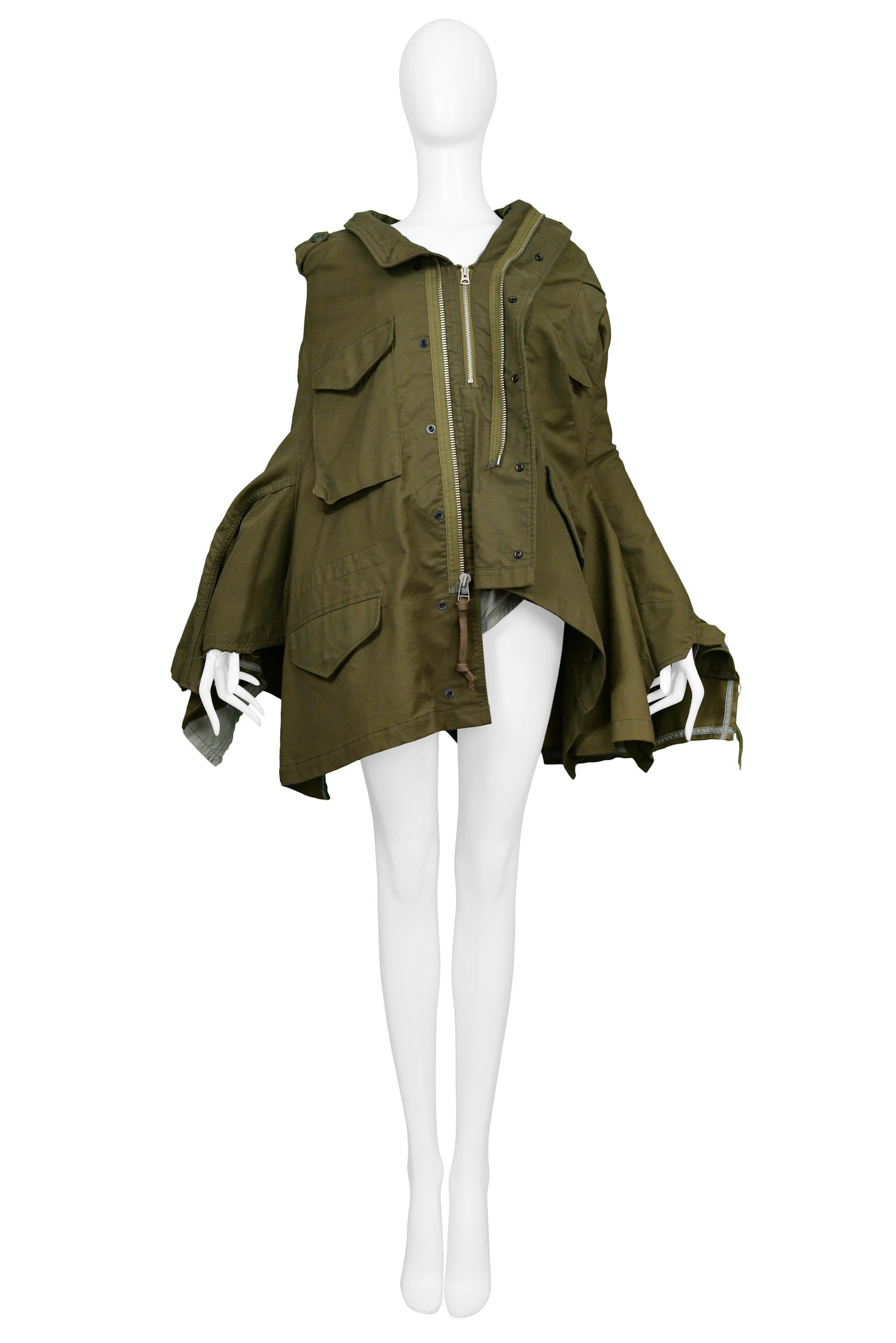 Resurrection Vintage is excited to offer a vintage Junya Watanabe for Comme Des Garcons army green deconstructed military-inspired cape featuring an asymmetrical hem, patch pockets, and zipper accents. 

Junya Watanabe
Size: S/M
Measurements: