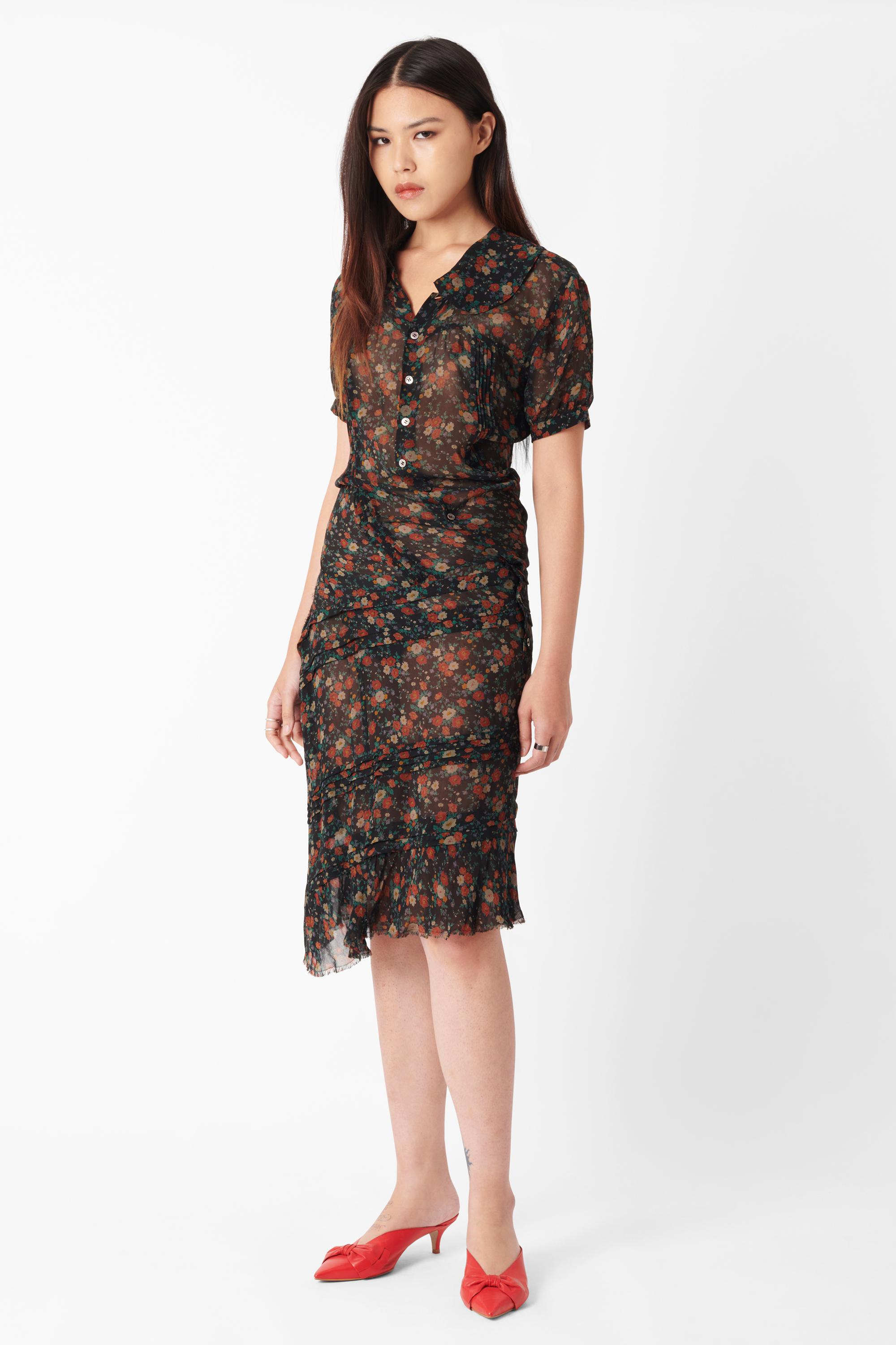 Junya Watanabe midi silk dress. Features floral print, asymmetric hem, collar and button closure, button down front, short capped sleeves, tiered detailing, sheer fabric in a midi length. In excellent vintage condition.

Brand: Junya