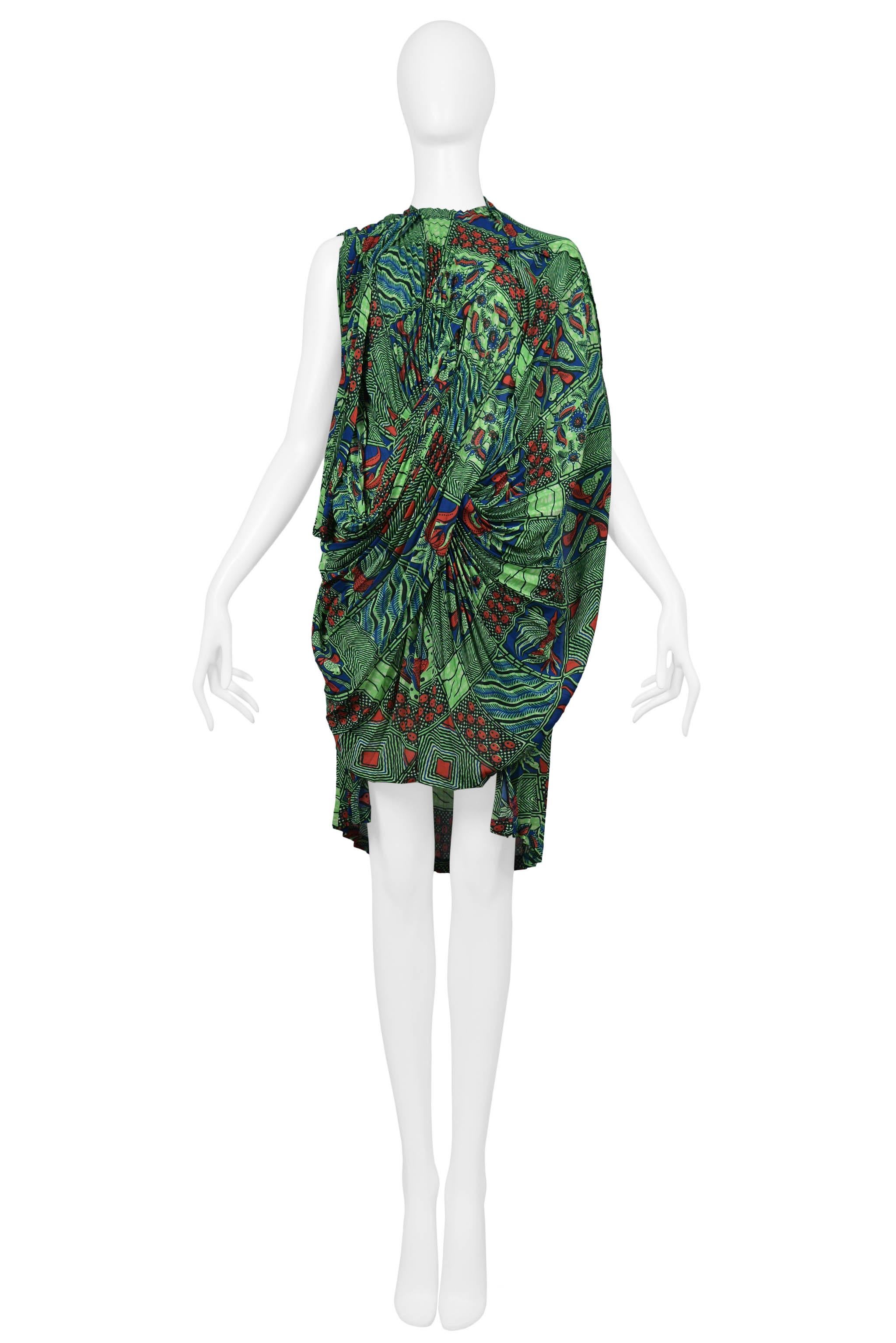 Resurrection Vintage is excited to offer a vintage Junya Watanabe Afrikaans print pleated dress featuring asymmetrical draping, high-low hemline, and one shawl sleeve. Collection 2009.

Junya Watanabe
Size: Small
Polyester 
2009 Collection
Excellent