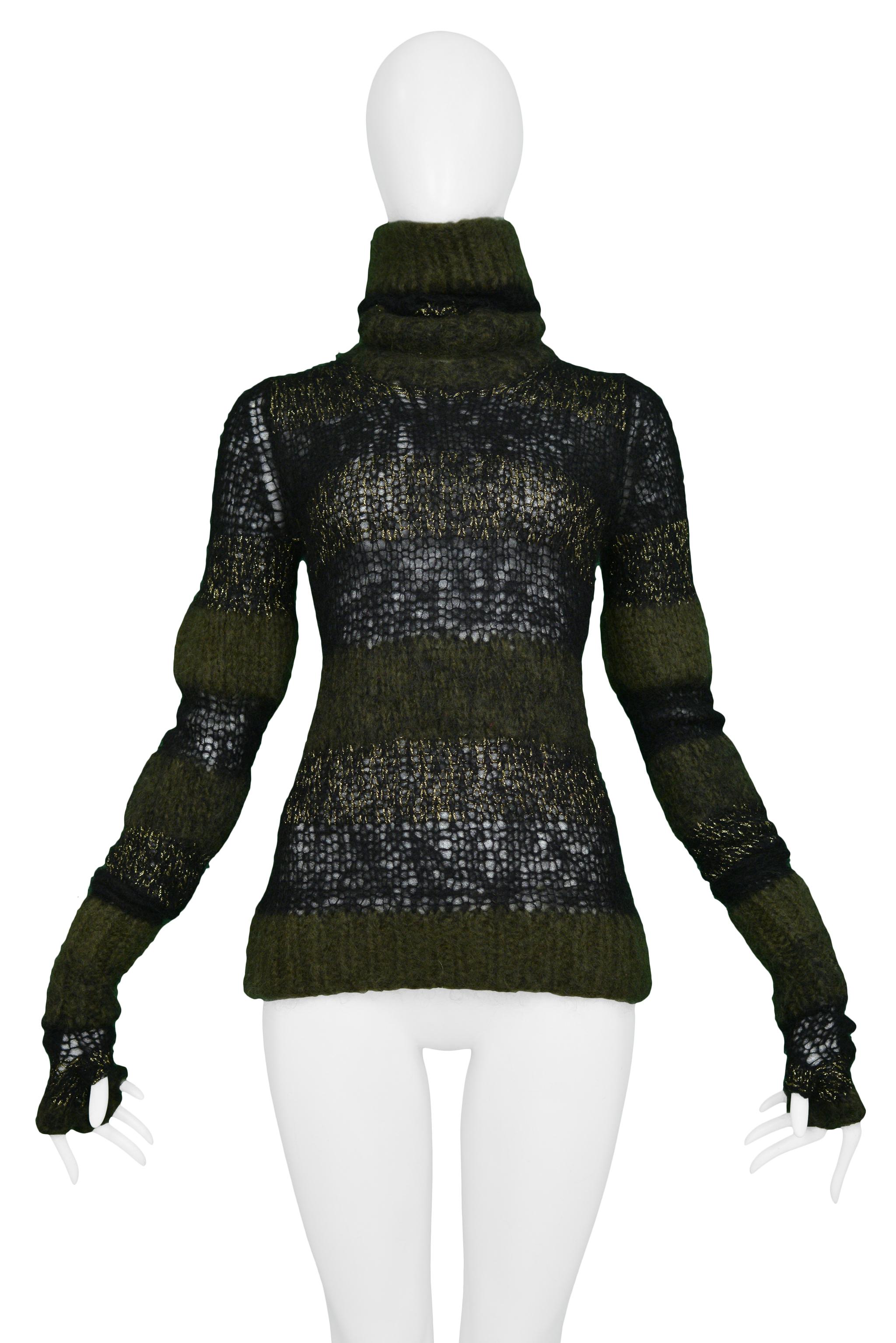 Resurrection Vintage is excited to offer a vintage Junya Watanabe black, metallic gold, and olive green cobweb sweater featuring a high neck, open weave panels, and extra-long sleeves with fingerless gloves. 

Junya Watanabe
Size: