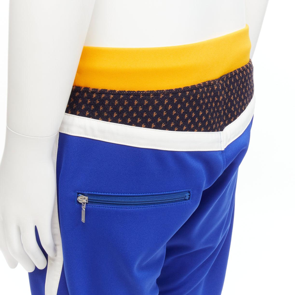 JUNYA WATANABE MAN 2017 blue yellow black colorblocked track pants L<br>Reference: JSLE/A00027<br>Brand: Junya Watanabe<br>Designer: Junya Watanabe<br>Collection: MAN 2017<br>Material: Polyester, Wool<br>Color: Yellow, Blue<br>Pattern: