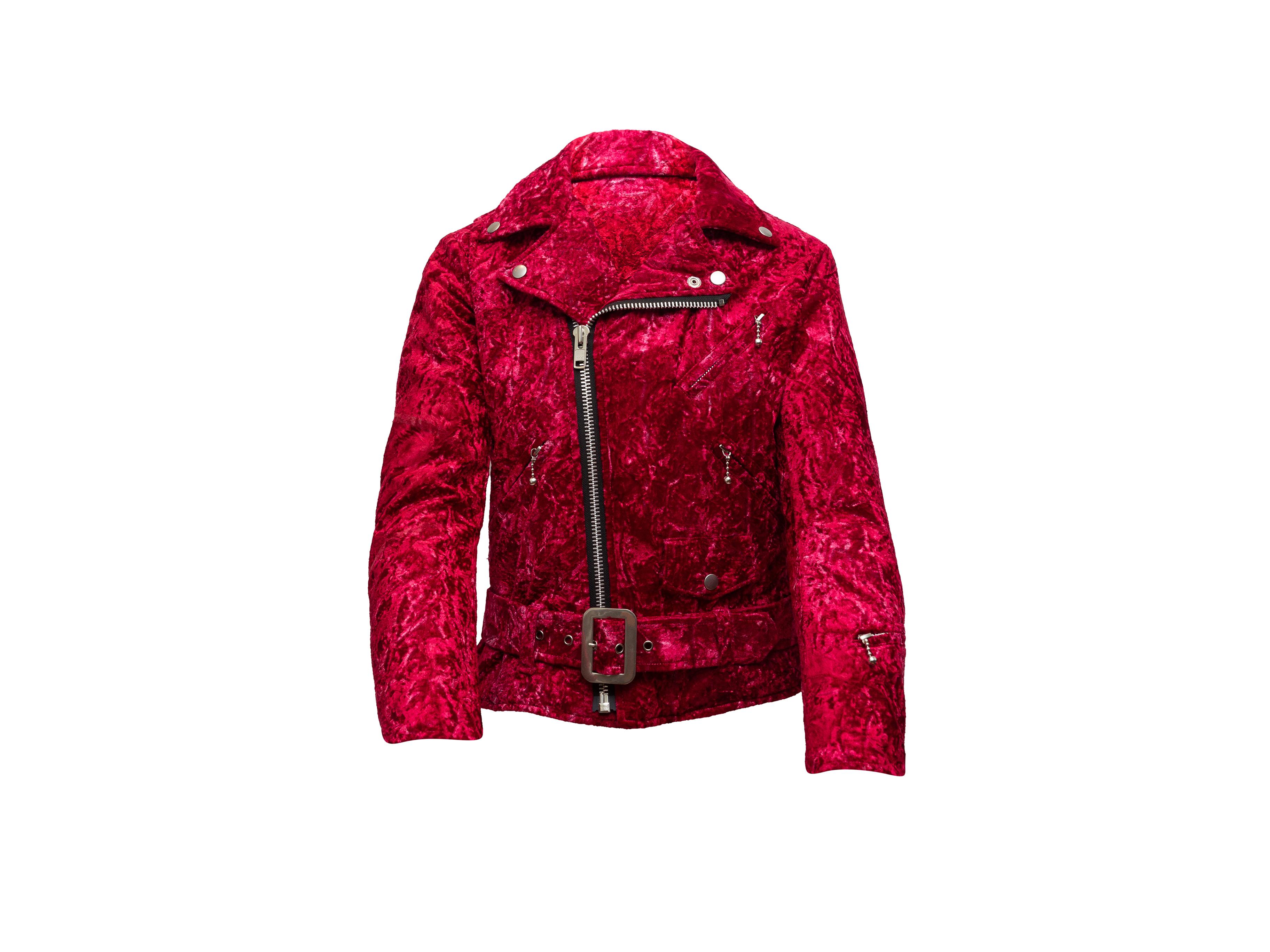Product details: Red crushed velvet moto jacket by Junya Watanabe Comme Des Garcons. Silver-tone hardware. Multiple front pockets. Belt accent at waist. Zip closure at front. 36
