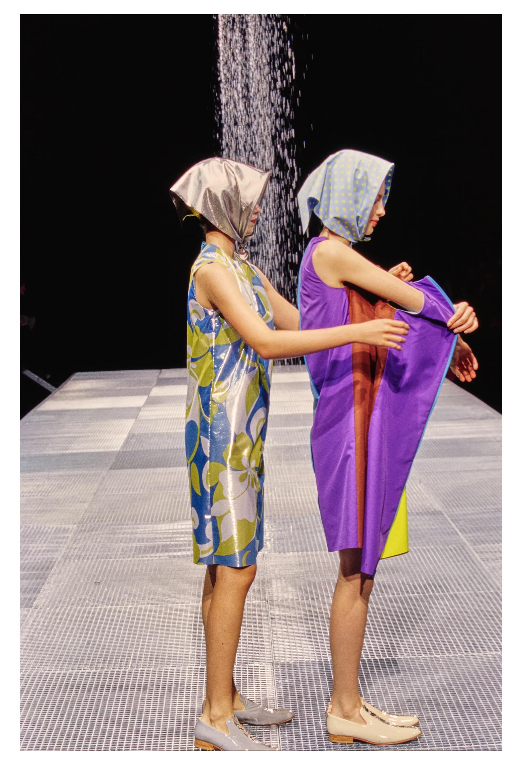 Resurrection Vintage is excited to offer a vintage Junya Watanabe reversible pink floral lame and black nylon tech dress from the Spring 2000 collection, which famously featured water-repellent fabric. The dress features a high neckline, mesh