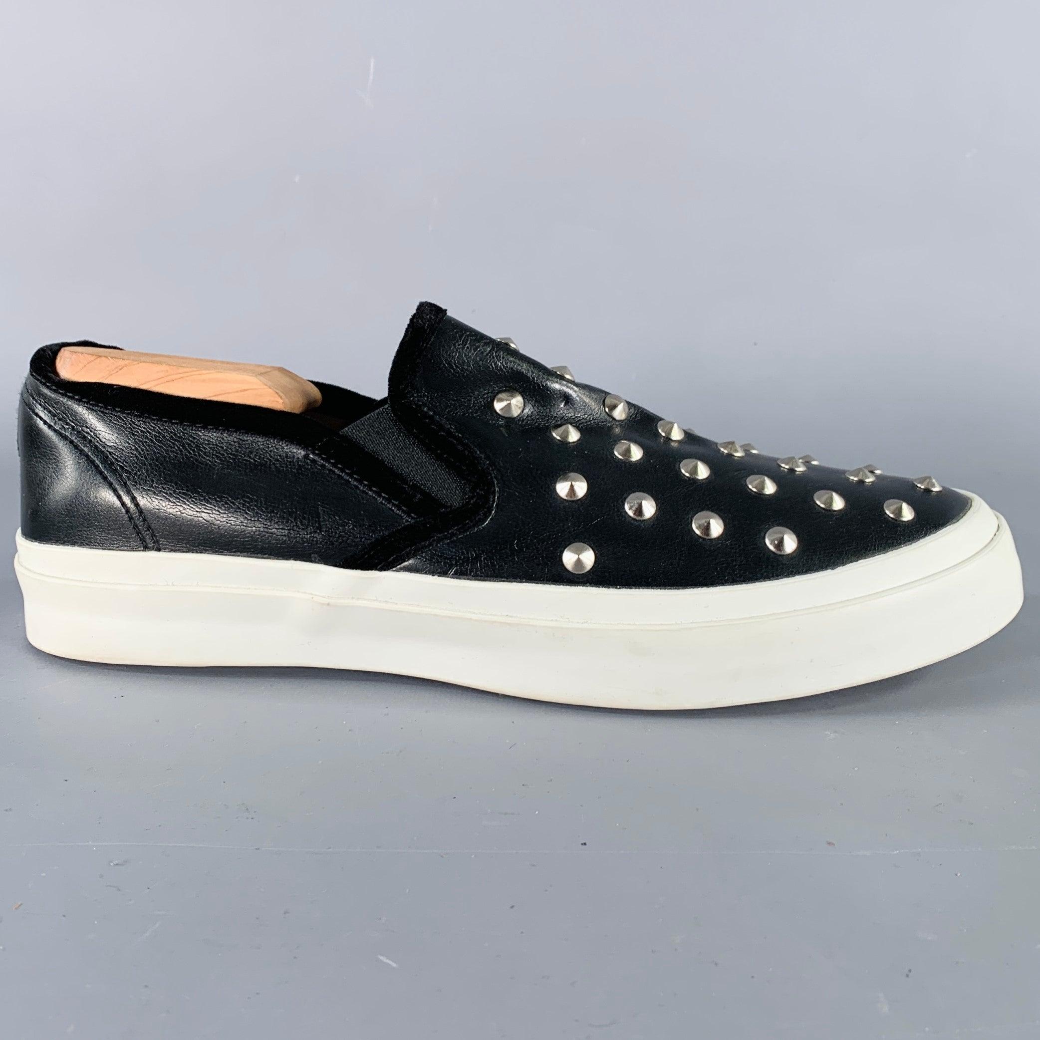 JUNYA WATANABE sneakers
in a black leather featuring a silver tone metal studded design, velvet trim, and slip on closure. Shoe trees not included.Very Good Pre-Owned Condition. 

Marked:   LOutsole: 10.75 x 3.75 inches 
  
  
 
Sui Generis
