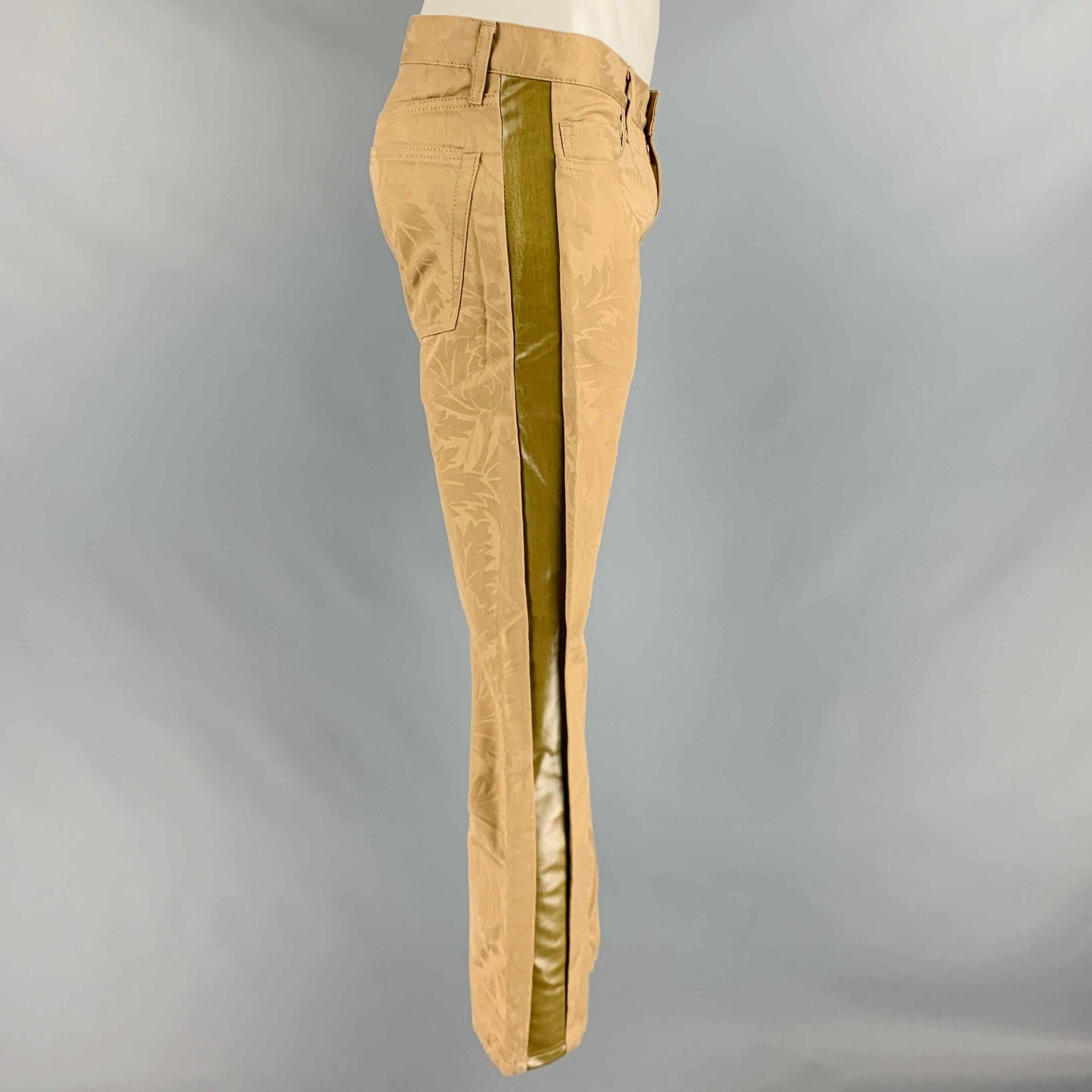 JUNYA WATANABE casual pants
in a beige cotton fabric featuring a low rise style, damask pattern, side stripes, and zip fly closure. Made in Japan.New With Tags. 

Marked:   L 

Measurements: 
  Waist: 35 inches Rise: 7.5 inches Inseam: 30 inches Leg