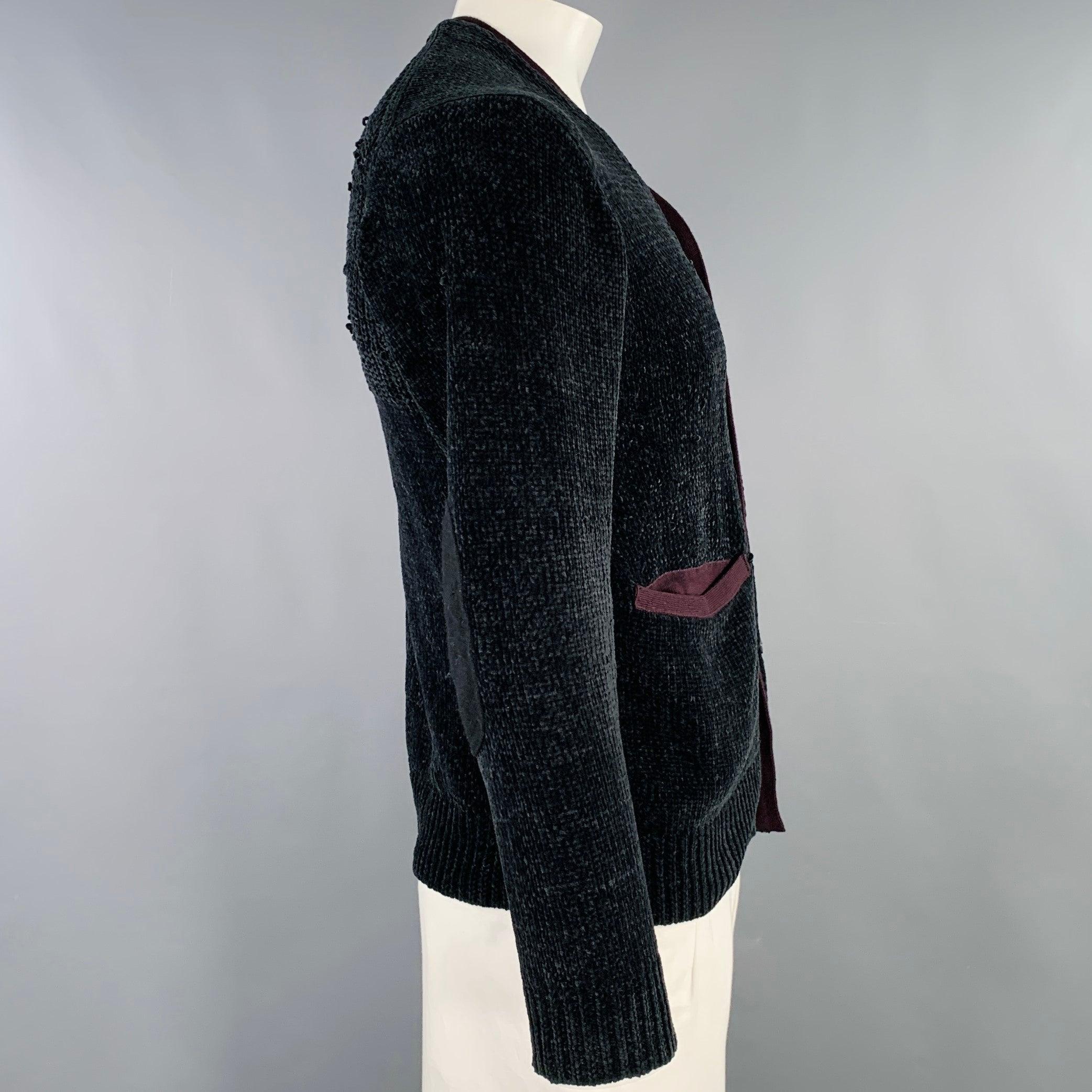 JUNYA WATANABE cardigan
in a black chenille knit featuring a brown knit trim, two pockets, and button closure. Made in Japan.Very Good Pre-Owned Condition. Moderate snags, as is. 

Marked:   L 

Measurements: 
 
Shoulder: 17.5 inches Chest: 41