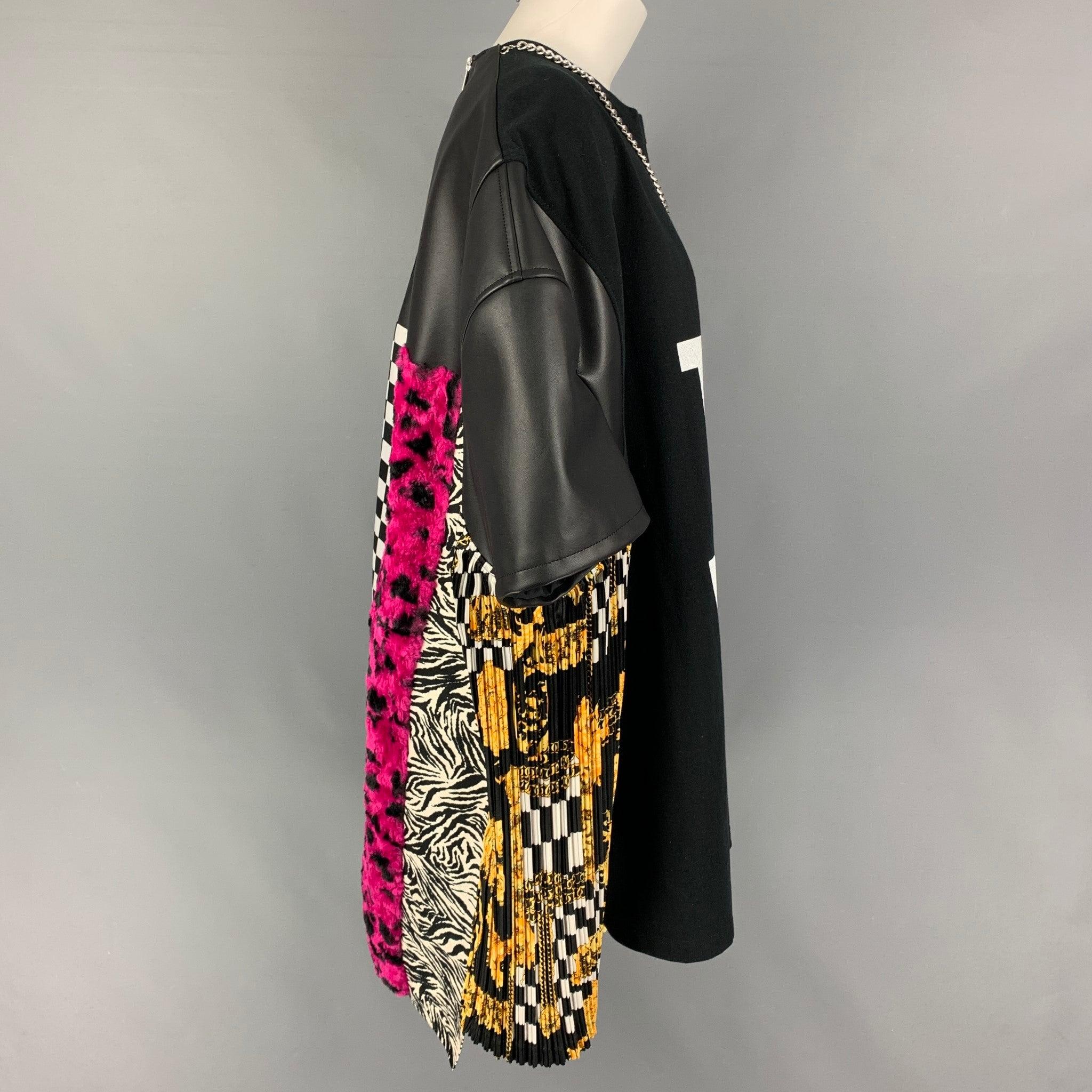 JUNYA WATANABE t-shirt comes in a black & multi-color mixed fabrics featuring a oversized fit, detachable chain, leather panels, back pleated design, mixed media design at lower back, and a back zipper closure. Made in Japan.
Excellent
Pre-Owned