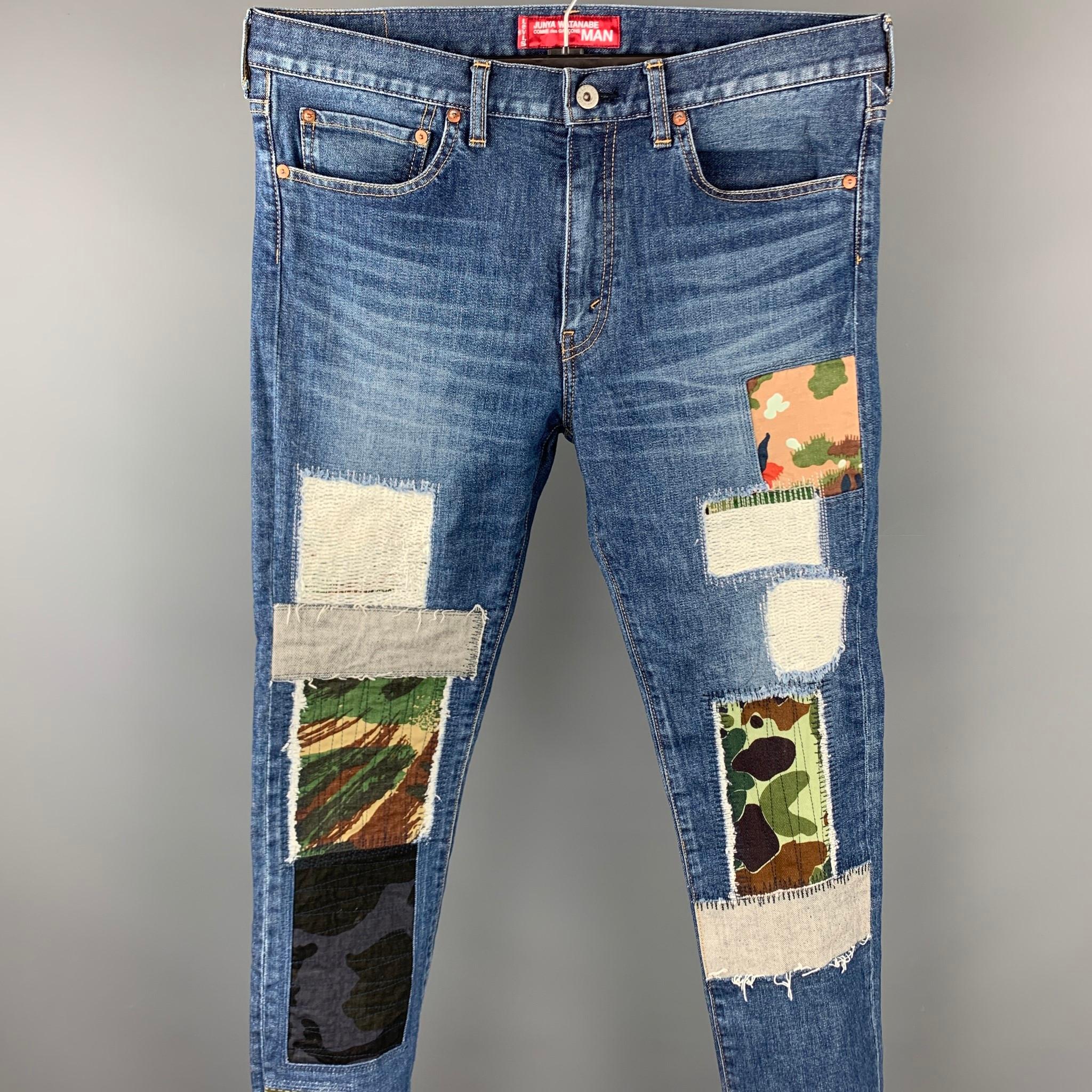 JUNYA WATANABE jeans comes in a indigo denim with patchwork details featuring a slim fit, contrast stitching, and a zip fly closure. Made in Japan.

Very Good Pre-Owned Condition.
Marked: L / AD 2018

Measurements:

Waist: 36 in.
Rise:9.5 in.