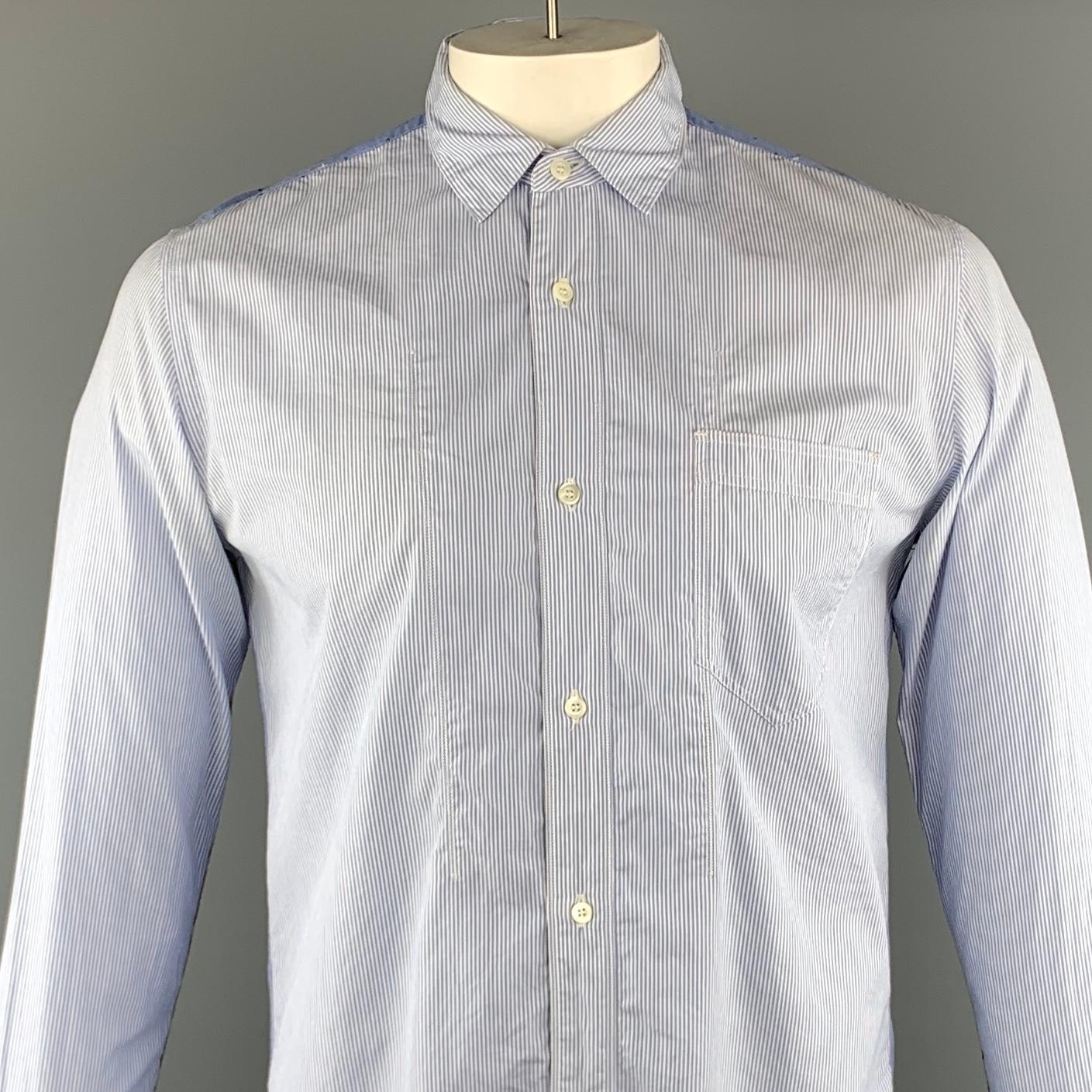 JUNYA WATANABE long sleeve shirt comes in a white and blue mixed fabric cotton featuring a button up style, sleeve paisley trim, back shoulder dotted trim, front patch pocket, and a spread collar. Made in Japan.
 
Excellent Pre-Owned