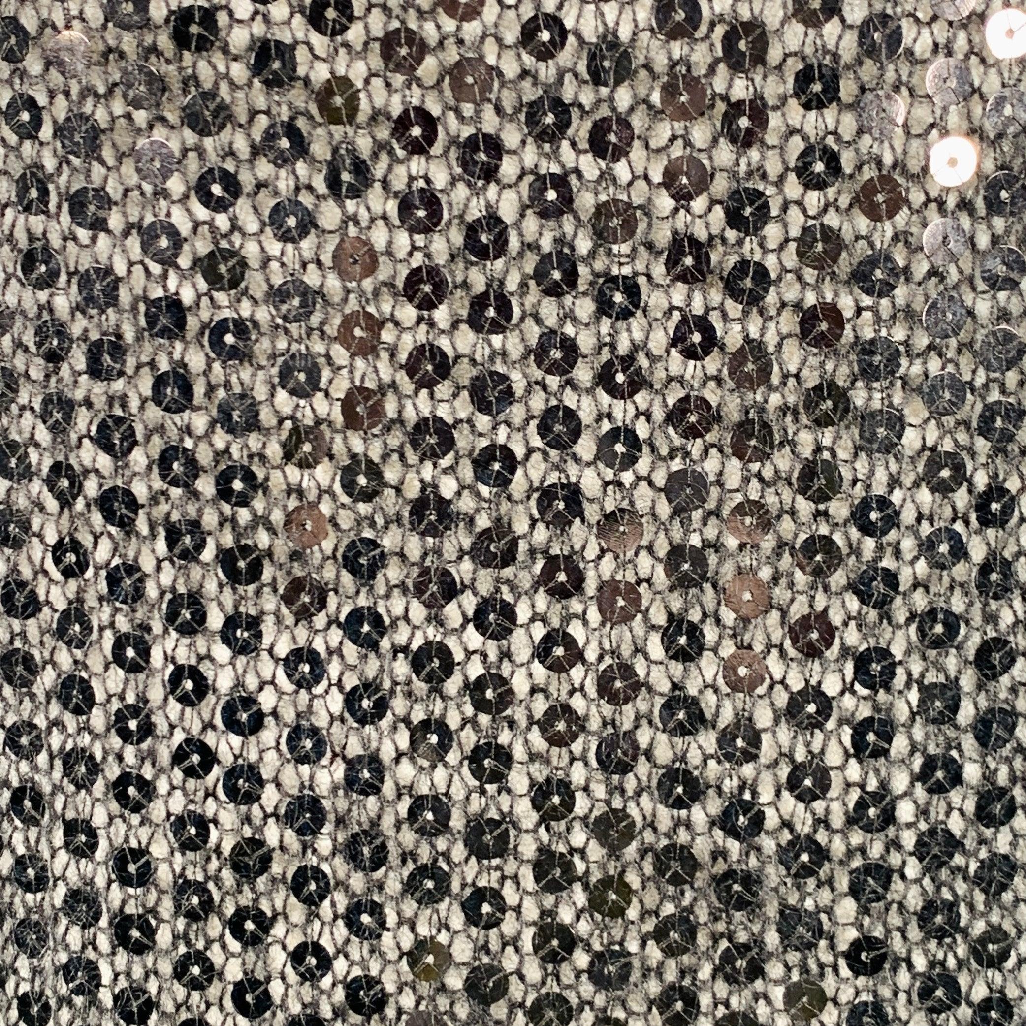 JUNYA WATANABE pullover
in a black knit fabric featuring an all over sequined design, sleeveless style, and crew neck. Made in Japan.Very Good Pre-Owned Condition. Minor signs of wear along arm holes. 

Marked:   M 

Measurements: 
 
Shoulder: 17