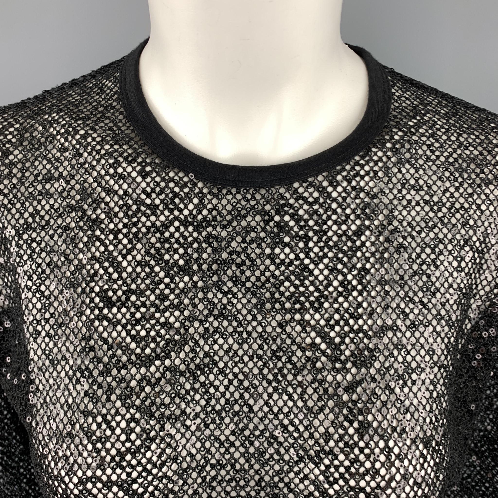 JUNYA WATANABE COMME des GARCONS pullover comes in black sequined mesh with a crewneck. Made in Japan.

Excellent Pre-Owned Condition.
Marked: M  AD 2017

Measurements:

Shoulder: 19 in.
Chest: 42 in.
Sleeve: 22 in. 
Length: 28.5 in.