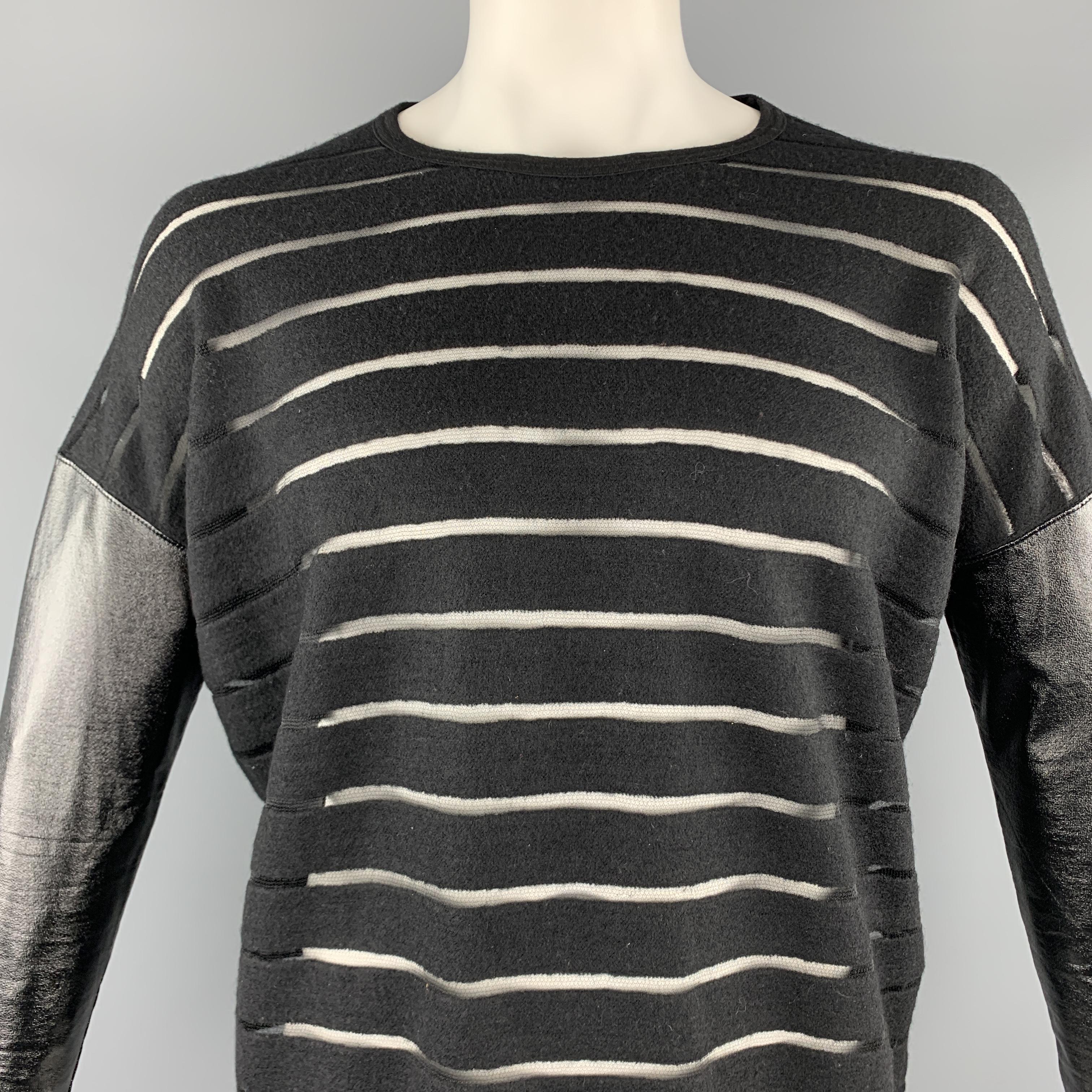 JUNYA WATANABE x COMME des GARCONS pullover comes in a black striped wool blend featuring mixed fabric sleeves, oversized, and a crew-neck. Made in Japan.

Excellent Pre-Owned Condition.
Marked: M

Measurements:

Shoulder: 28.5 in. 
Chest: 56 in.