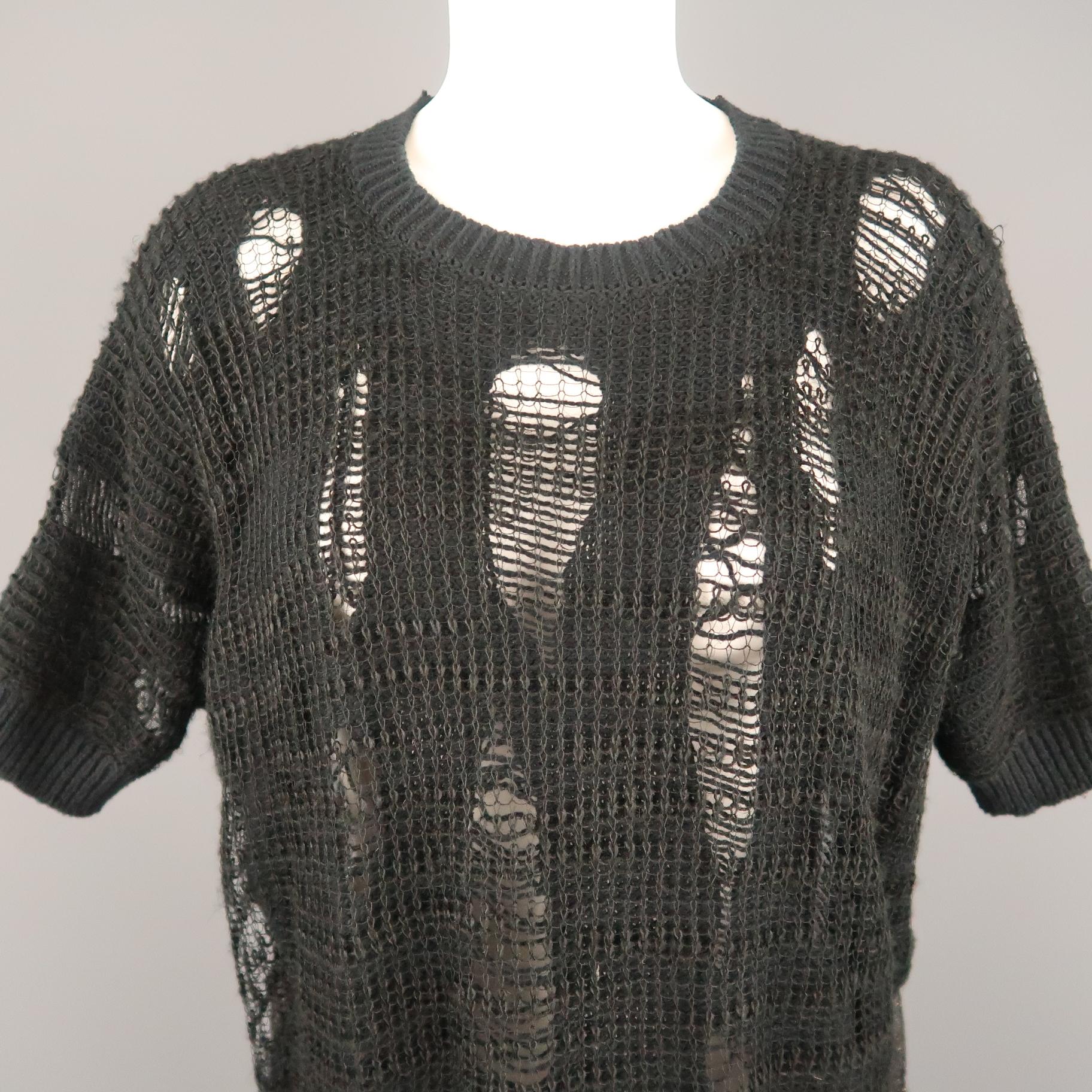 JUNYA WATANABE pullover features a distressed knit front with mesh knit overlay, short batwing sleeves, crewneck, and sheer sparkle knit back. Made in Japan.
 
Excellent Pre-Owned Condition.
Marked: S (AD2015)
 
Measurements:
 
Shoulder: 20