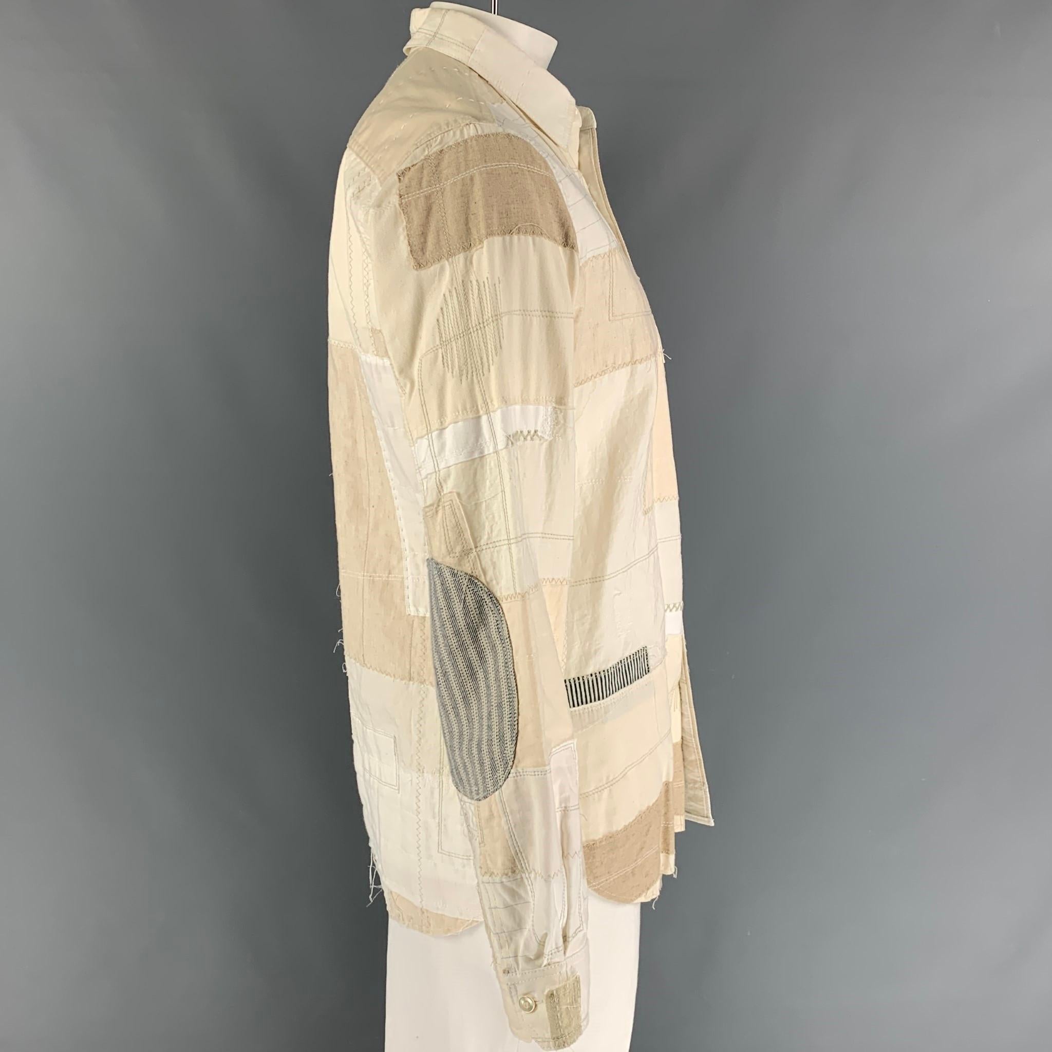 JUNYA WATANABE long sleeve shirt comes in a beige patchwork cotton / linen featuring a front pocket, spread collar, and a buttoned closure. Made in Japan. 

Very Good Pre-Owned Condition.
Marked: XL / AD2014

Measurements:

Shoulder: 18 in.
Chest: