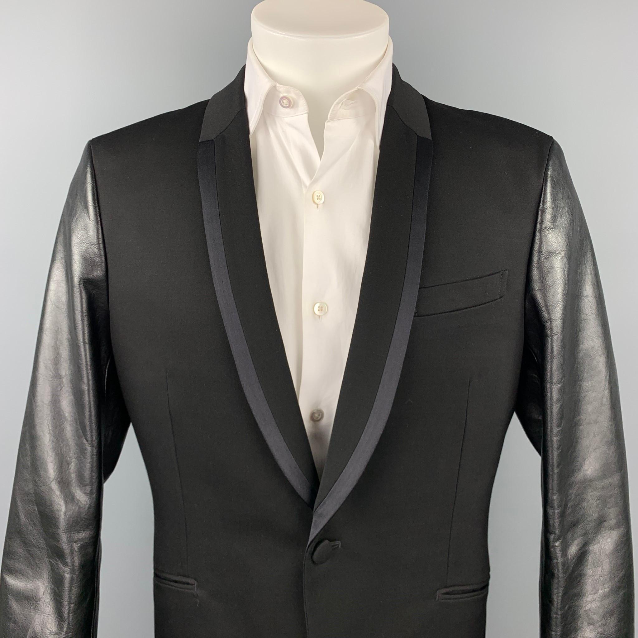 JUNYA WATANABE sport coat comes in a black wool with leather sleeves featuring a shawl collar, full liner, slit pockets, and a single button closure. Made in Japan.

Excellent Pre-Owned Condition.
Marked: XL / AD2015

Measurements:

Shoulder: 18