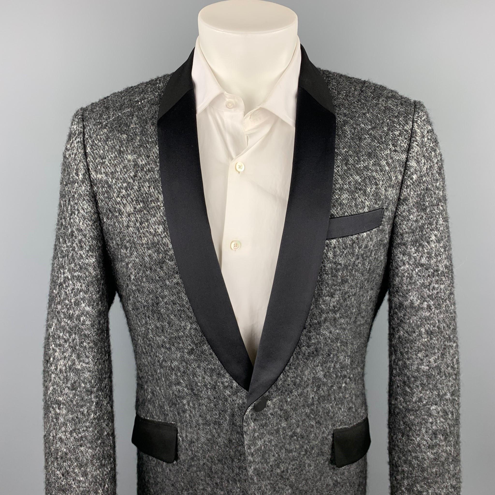 JUNYA WATANABE sport coat comes in silver & black tweed wool blend with a full liner featuring a shawl lapel, flap pockets, and a single button closure. Made in Japan.

Excellent Pre-Owned Condition.
Marked: XL

Measurements:

Shoulder: 18