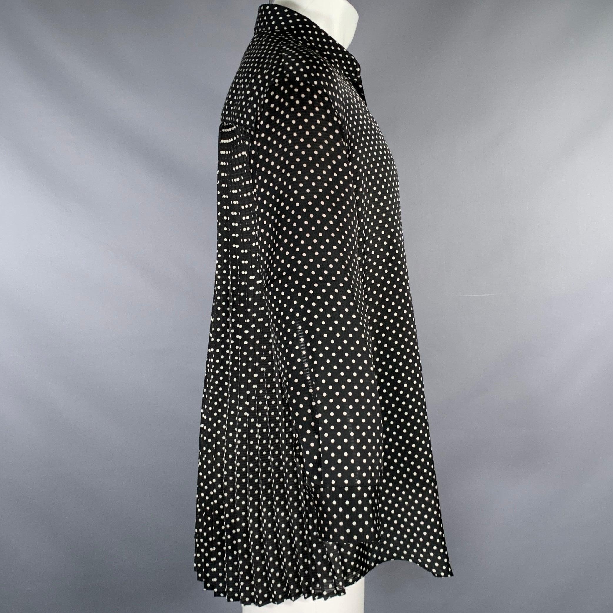 JUNYA WATANABE for COMME des GARCONS shirt
in
a black and white polyester fabric featuring a polka dot pattern, pleated back, and button closure. Made in Japan.Excellent Pre-Owned Condition. 

Marked:   XS 

Measurements: 
 
Shoulder: 19 inches