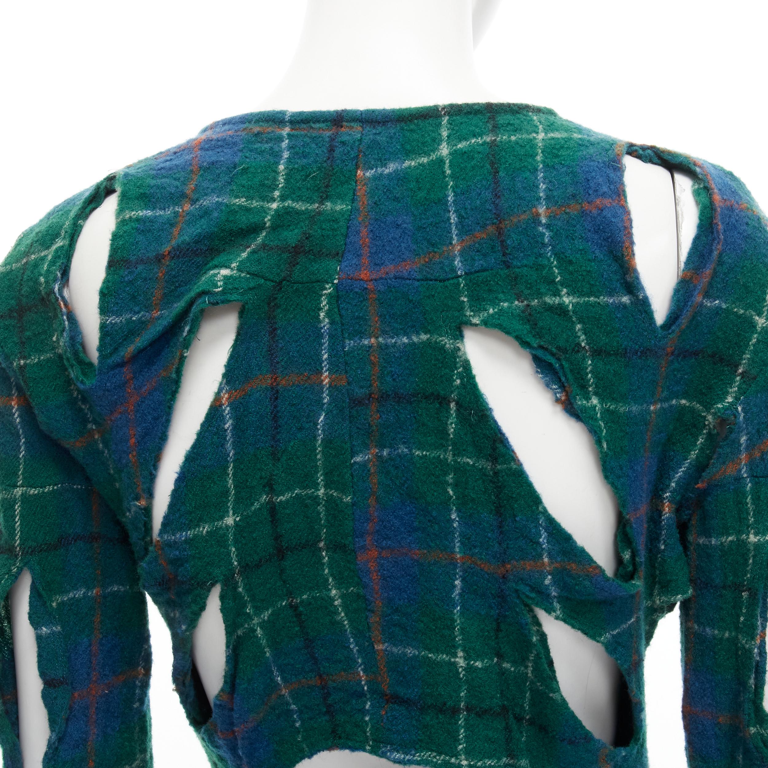 JUNYA WATANABE Vintage 1995 green punk plaid boiled wool slash cut out jacket S 
Reference: CRTI/A00590 
Brand: Junya Watanabe 
Collection: 1995 
Color: Green 
Pattern: Check 
Closure: Zip Extra Detail: Slashed cut out design throughout. 
Made in: