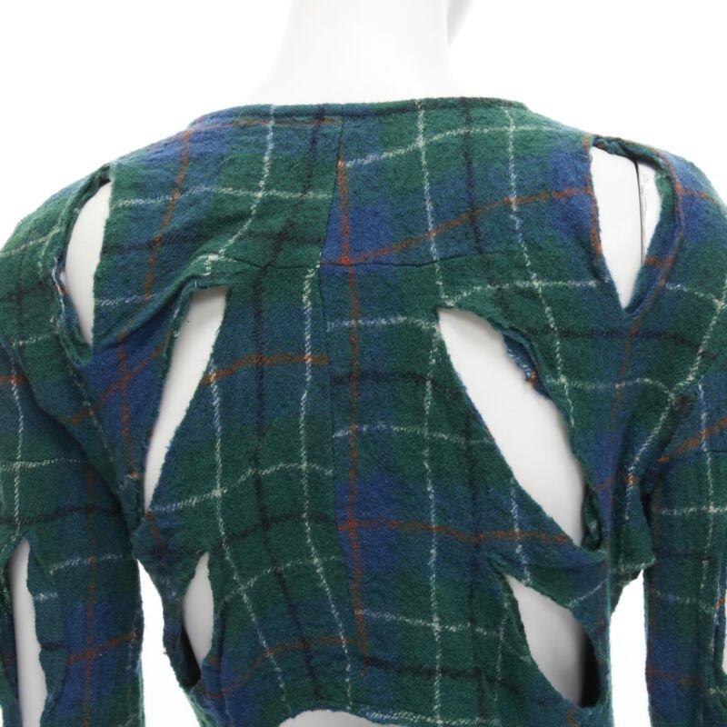 JUNYA WATANABE Vintage 1995 green punk plaid boiled wool slash cut out jacket S
Reference: CRTI/A00590
Brand: Junya Watanabe
Designer: Junya Watanabe
Collection: 1995
Color: Green, Blue
Pattern: Checkered
Closure: Zip
Extra Details: Slashed cut out