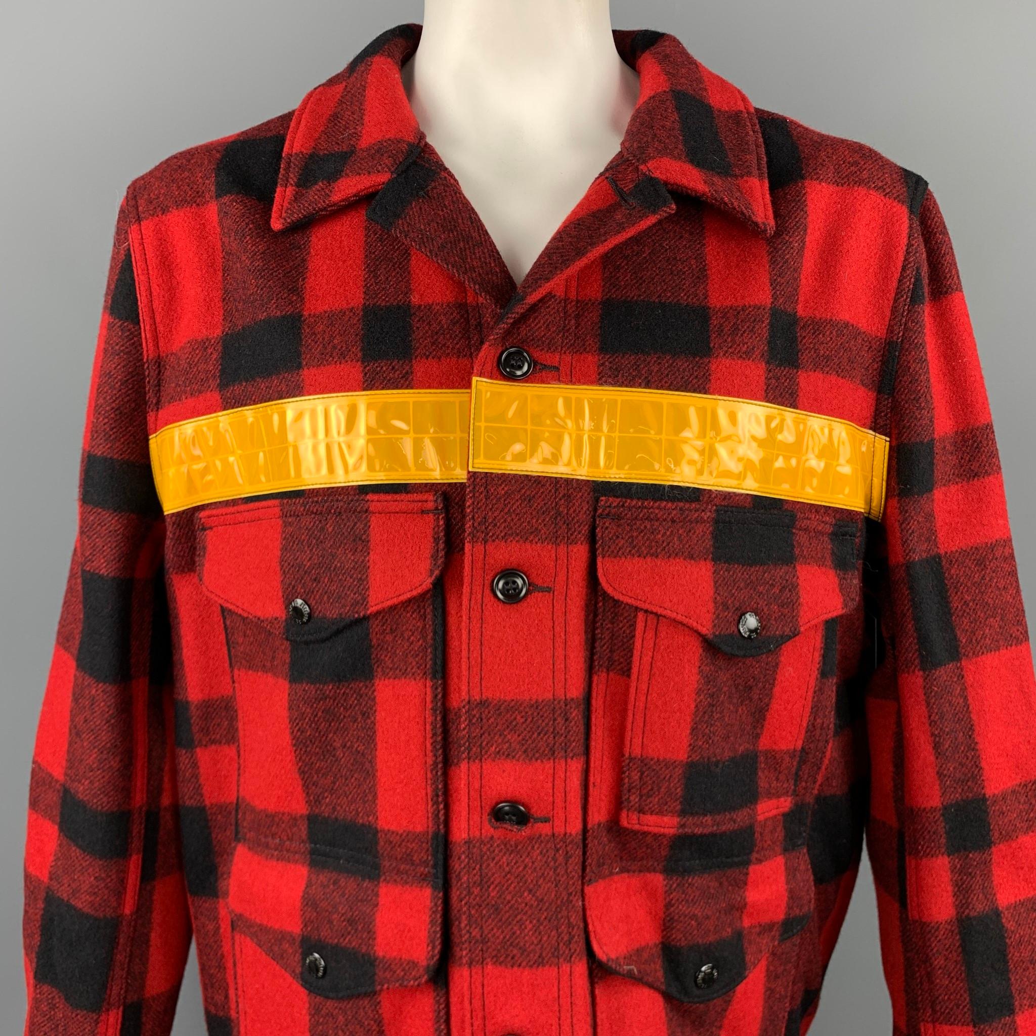 JUNYA WATANABE MAN x FILSON jacket comes in a red & black buffalo plaid wool with a yellow reflective stripe detail featuring front patch pockets, leather elbow patches, nylon back, and a buttoned closure.  Made in Japan / USA.

Excellent Pre-Owned