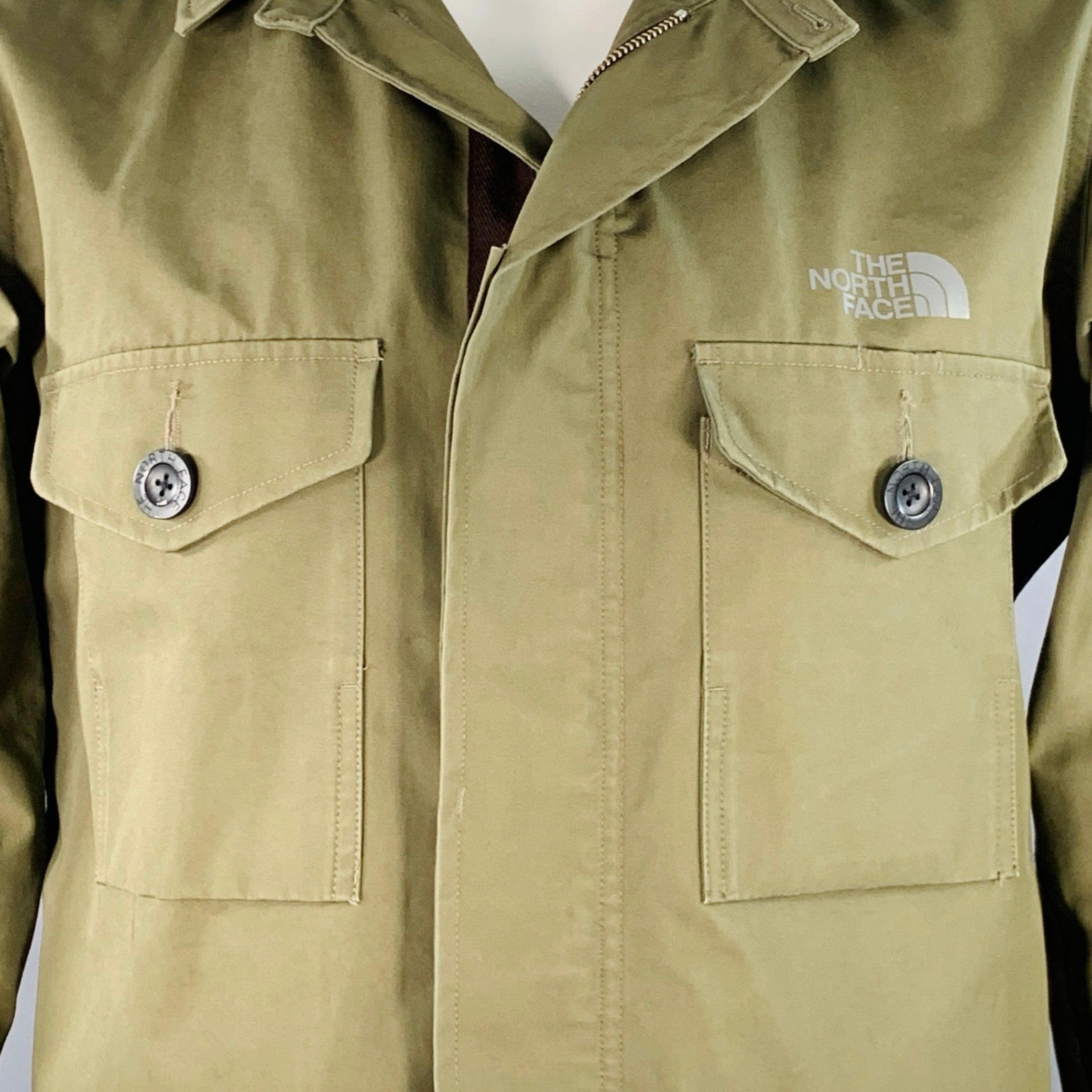 JUNYA WATANABE x THE NORTH FACE FW17 jacket
in an olive green cotton nylon fabric featuring a detachable hooded style, four exterior pockets (two buttoned on the chest, two slip), and zip & hidden buttons closure.Excellent Pre-Owned Condition. 