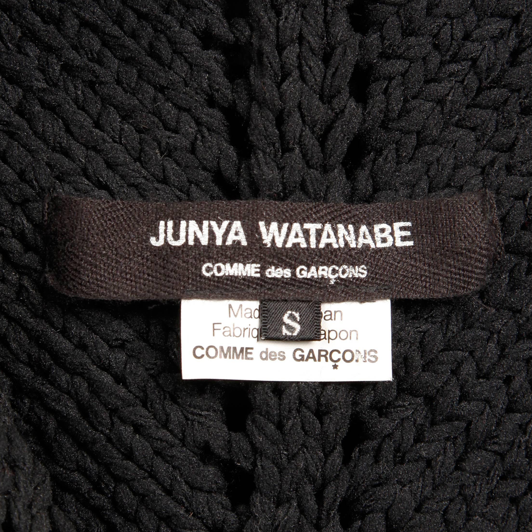 Amazing Junya Watanbe for Comme des Garcons black wool knit sweater top. Unlined with no closure (pulls on over head). The marked size is small. Stretchy black fabric is not faded (we lightened the photos to show detail). Excellent vintage condition