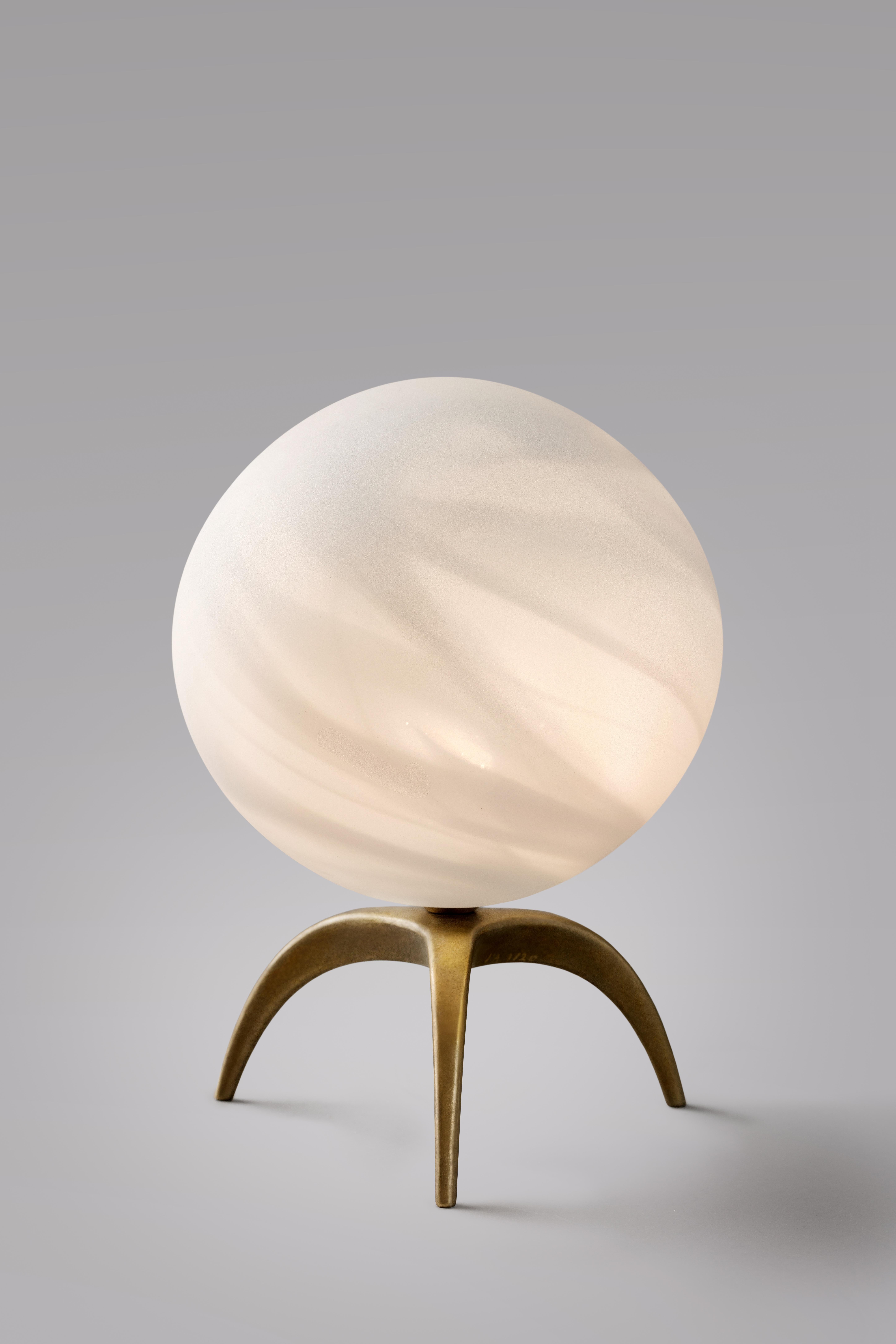 Jupiter blown glass table lamp - Ludovic Clément d’Armont
Blown glass and brass.
Dimensions: 30 x 20 x 20 cm.

Ludovic Clément d’Armont is in the continuation of a family tradition of centuries of gentle glassmakers, painters, carpenters and