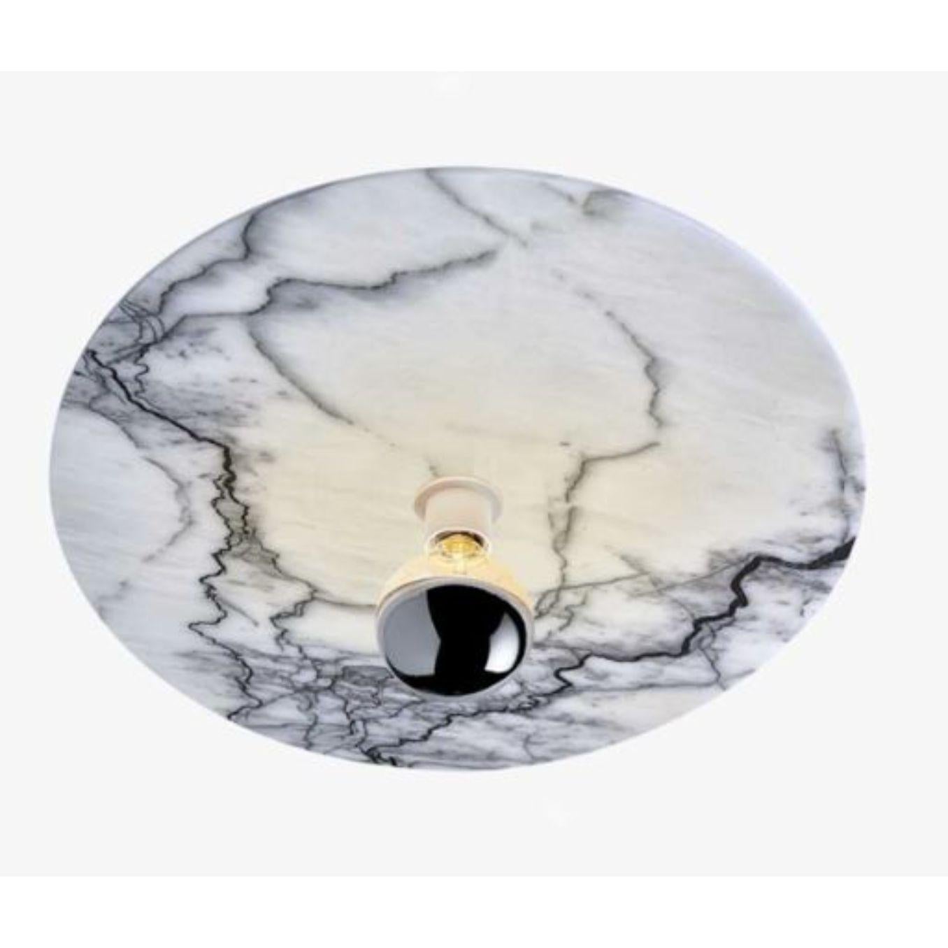 Plafoniera Jupiter di Radar.
Design: Bastien Taillard
Materiali: Marmo, struttura in metallo termolaccato nero opaco, anello frontale termolaccato bianco opaco.
Dimensioni: D 60 x H 10 cm.

Tutte le nostre lampade possono essere cablate a