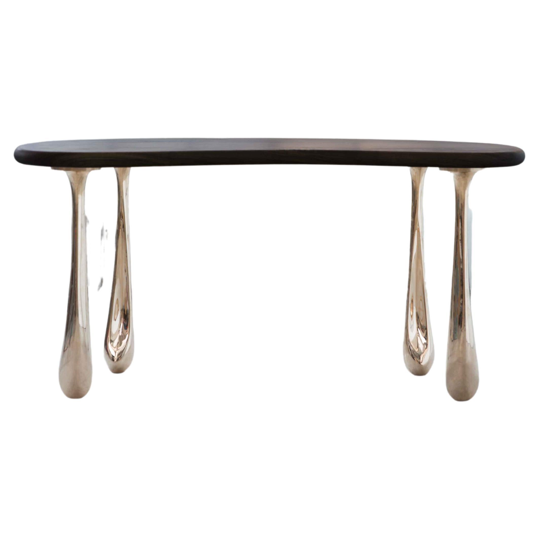 The Jupiter Dining Table pairs STACKLAB’s signature solid-bronze Jupiter leg castings with domestic hardwood table top.

The Jupiter leg is a study in creating a completely asymmetrical, yet aesthetically cohesive, geometry. The shape, derived