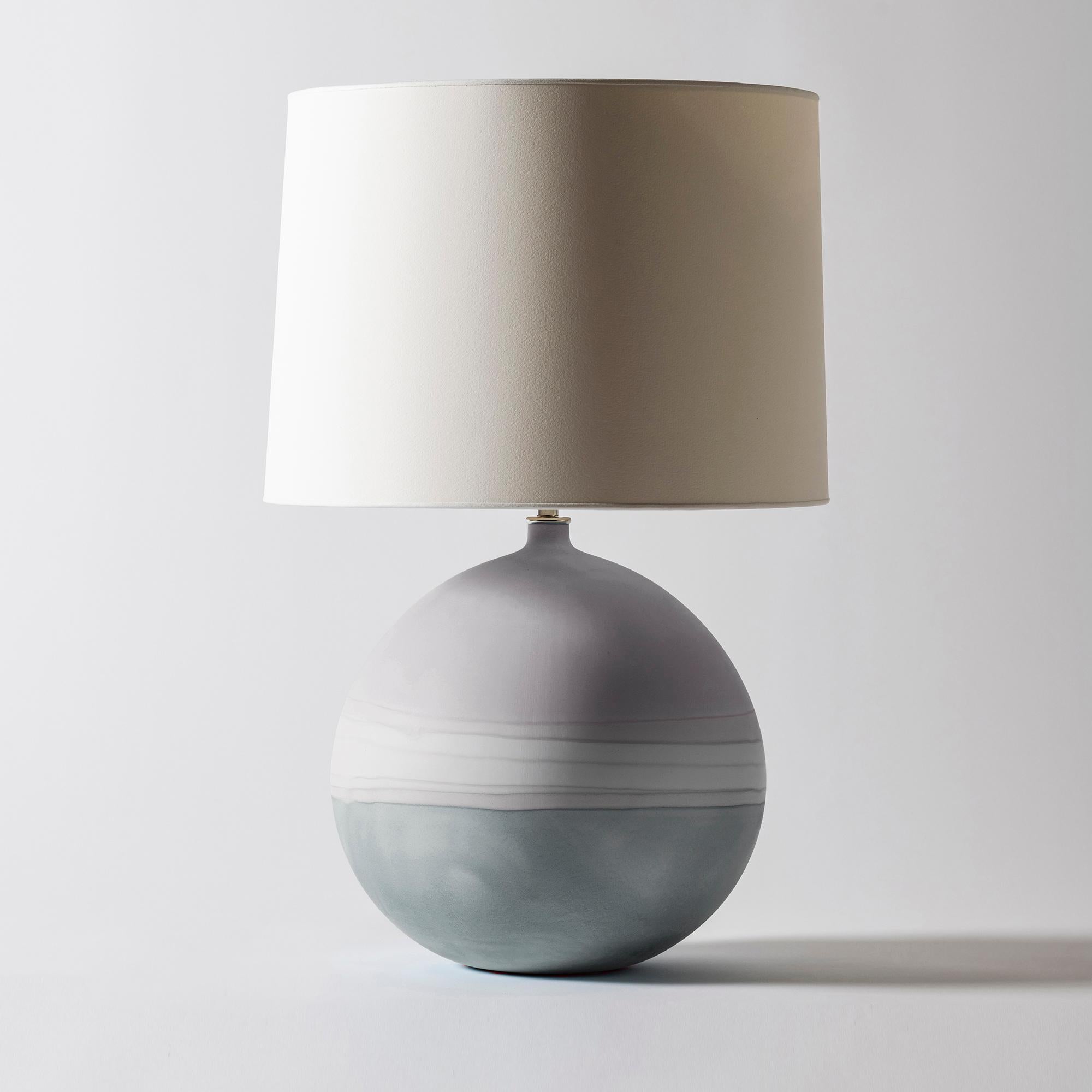 Jupiter lamp in Grey Ombré by Elyse Graham
Dimensions: D38 x H61 cm
Materials: Plaster, Resin, Cotton rag Paper, brass, Nickel. HARDWARE: POLISHED NICKEL-PLATED BRASS UNO THREADED SOCKET
with TURN KEY SWITCH, IN-LINE DIMMER.
MOLDED, DYED, AND