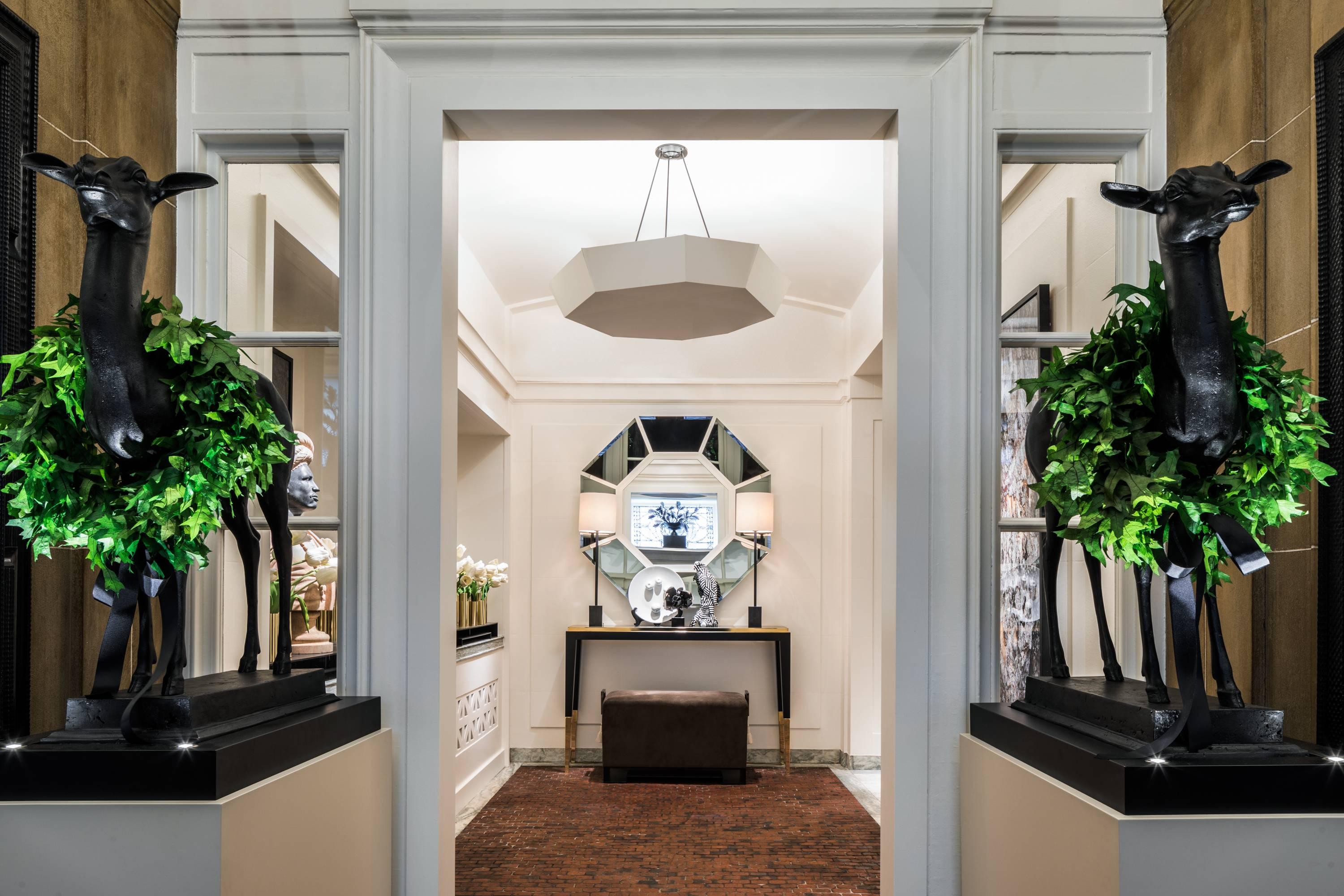 Asymmetrical octagonal fiberglass reinforced plaster pendant; canted sides rise to a concave central point. Suspended from three metal armatures with 6”dia. ceiling canopy, overall height site specific. (3) Inc/med/A19/60 – not included ULC