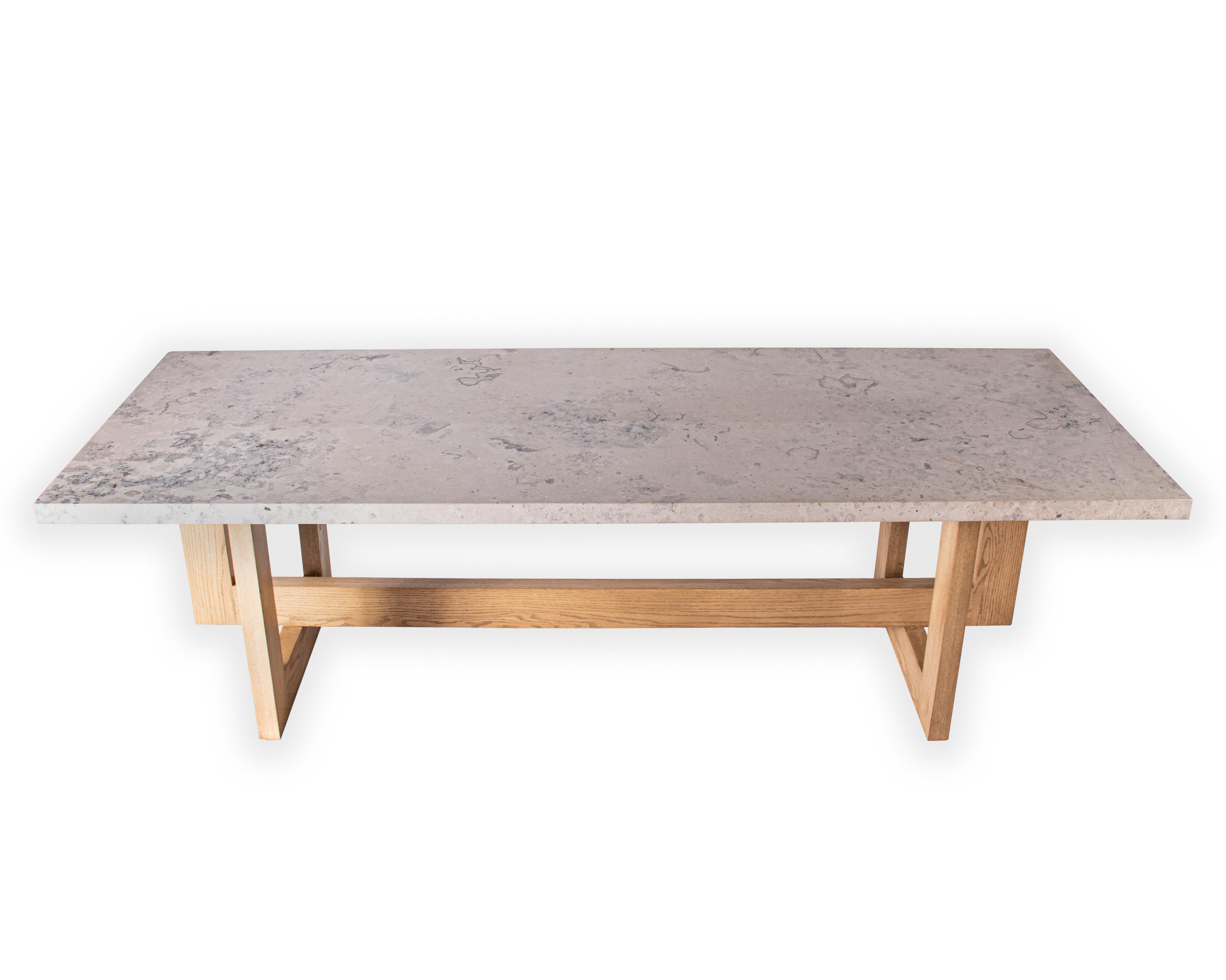 Vision and design custom jura grey marble dining table with an oak geometric base and Cairo finish.

 Designed by Brendan Bass for the Vision and Design Collection, by using high quality materials and textures. All materials are sourced from local