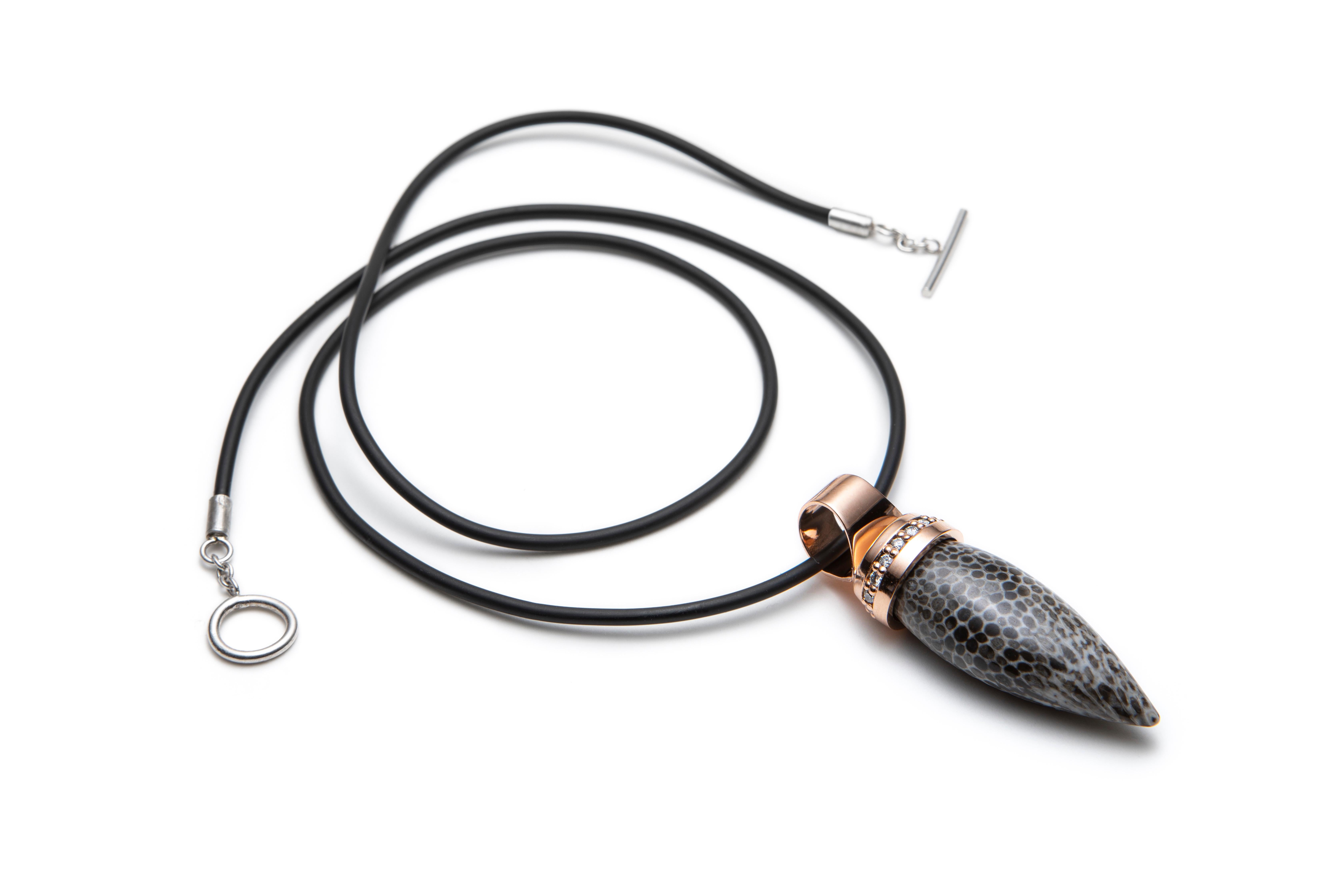 JURASSICA Pendant in 18K Rose Gold set with Fossil Agate and Diamonds

This pendant features a stunning 1.3 inch fantasy cut fossilized coral agate. To add a touch of light a row of diamonds is set in the 18K rose gold mounting that holds the stone.