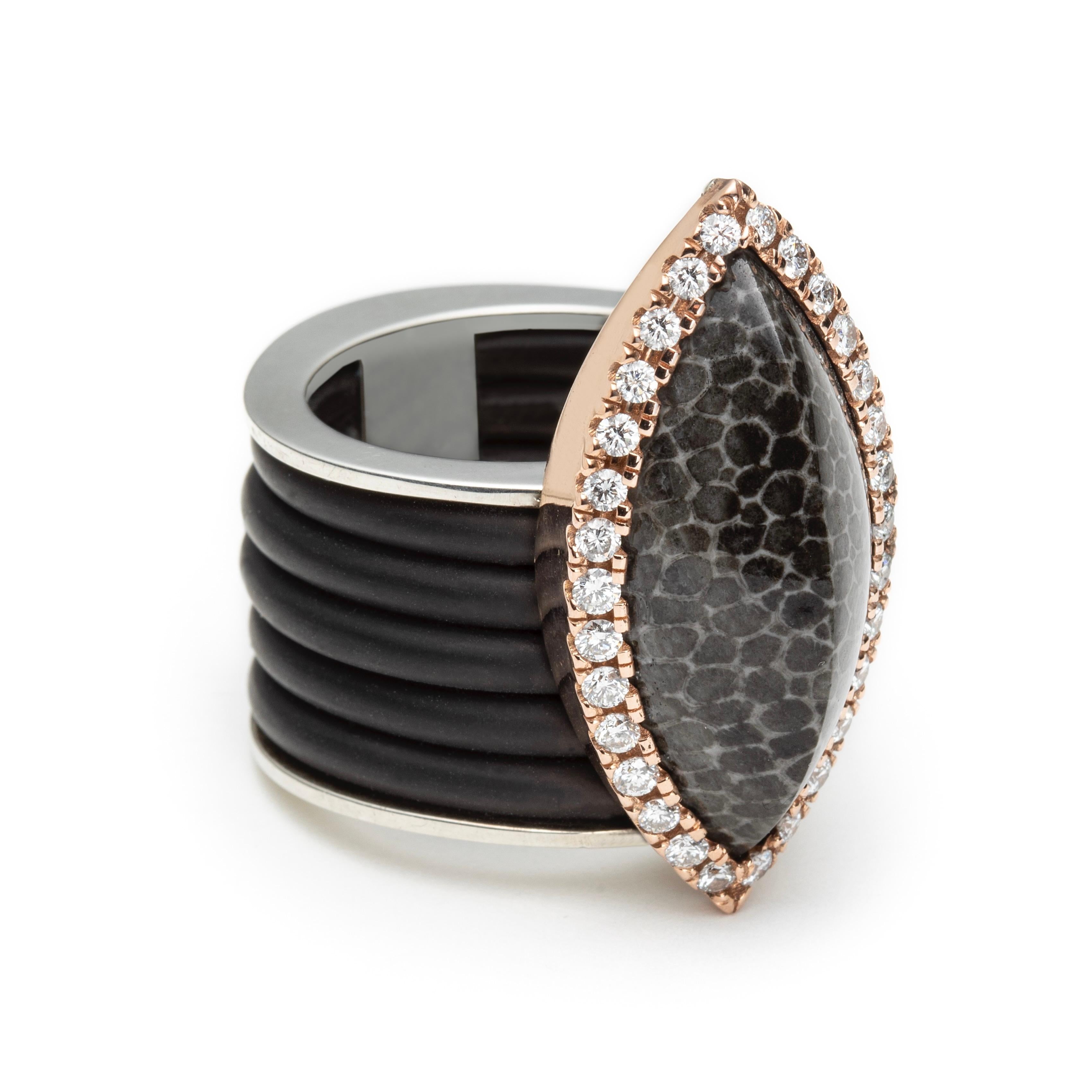 JURASSICA Ring in 18K Rose Gold Silver with Fossil Agate + Diamonds by Serafino

This ring features a stunning 1 inch fossilized coral agate cabochon surrounded by a diamond halo set in 18K rose gold. The shank of the ring is made of a sterling