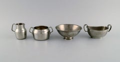 Just Andersen (1884-1943), Denmark. Art Deco pewter creamer and three bowls.