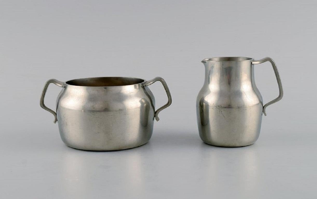 Danish Just Andersen (1884-1943), Denmark. Art Deco pewter creamer and three bowls. For Sale