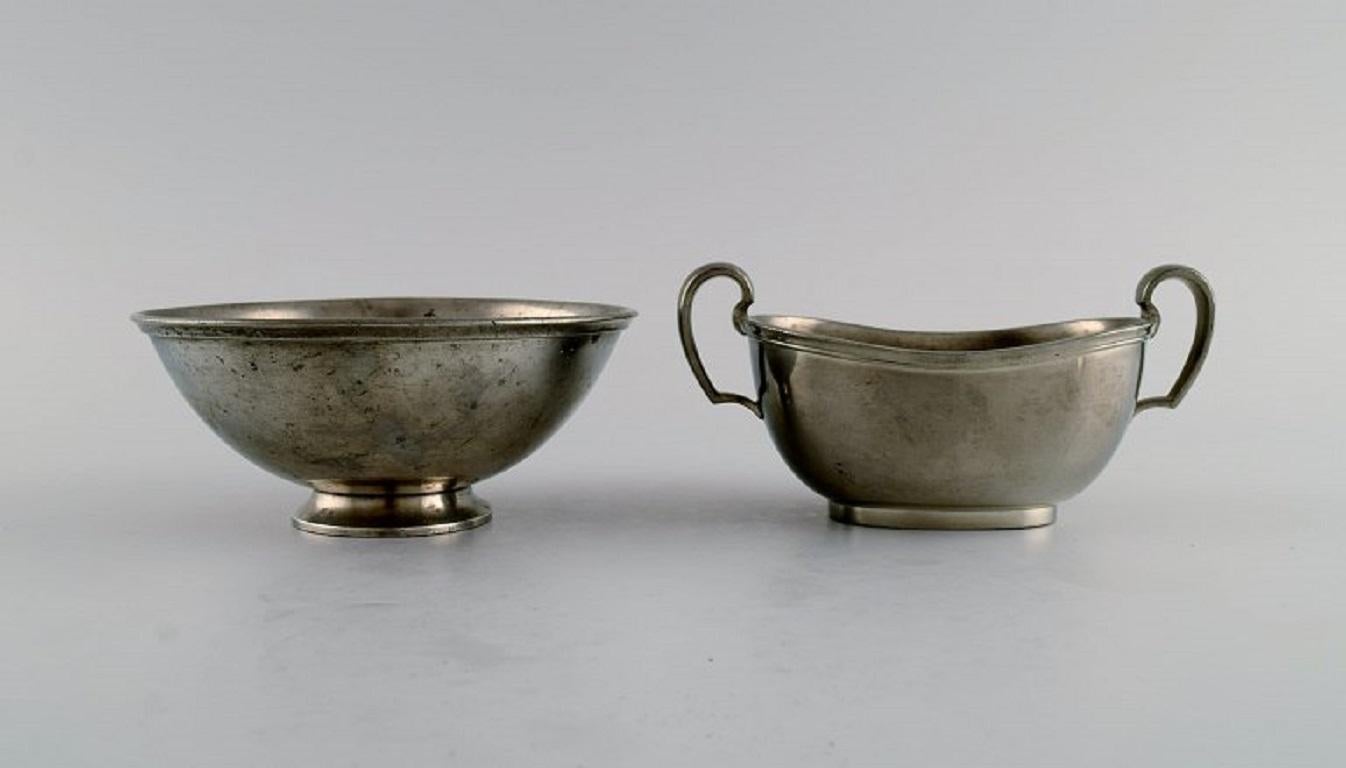Mid-20th Century Just Andersen (1884-1943), Denmark. Art Deco pewter creamer and three bowls. For Sale