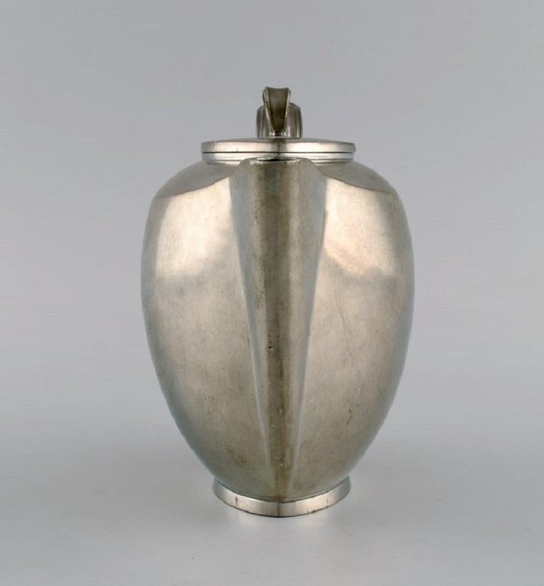 Danish Just Andersen, Denmark, Art Deco Tin Coffee Pot with Wicker Handle For Sale