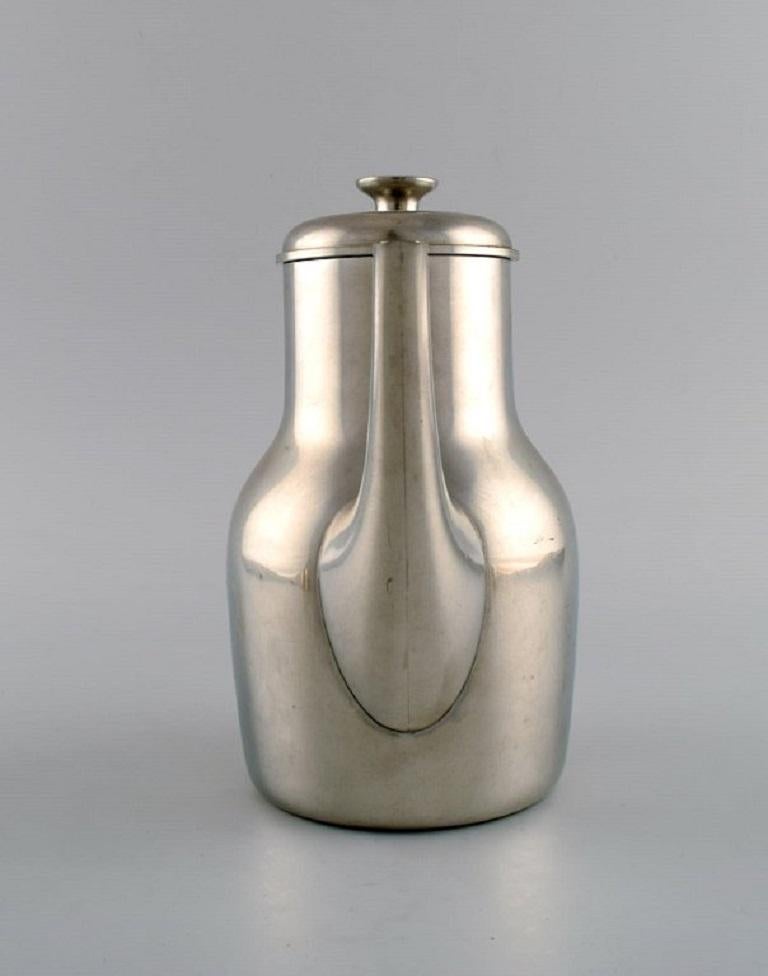Wicker Just Andersen (1884-1943), Denmark.  Art Deco tin coffee pot with wicker handle. For Sale