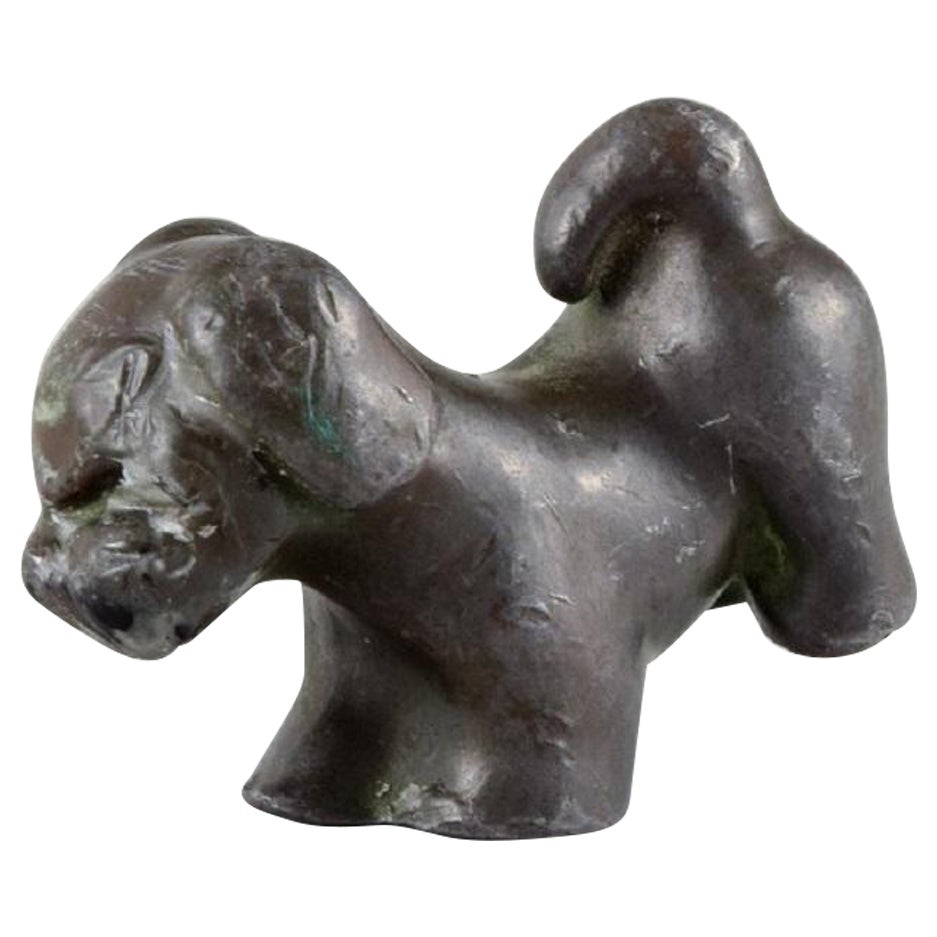 Just Andersen 
1884-1943
, Denmark, Rare and Early Puppy in Disco Metal