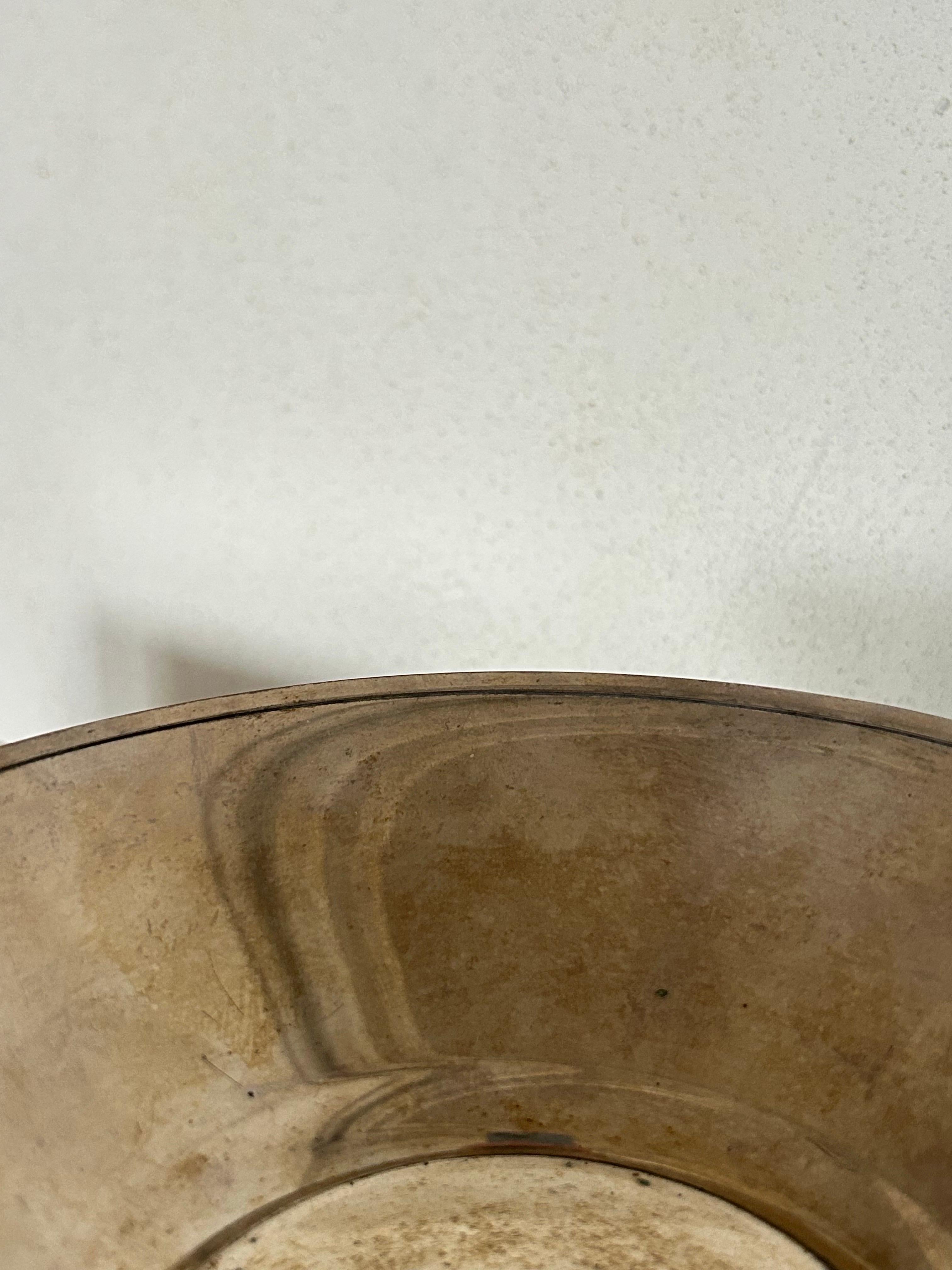 A refined silver bowl by Danish designer and metalsmith Just Andersen (1884–1943), model number 03, executed circa 1930s.

Best known for his pioneering work in pewter, bronze, and the proprietary alloy Disko Metal, Andersen also created select