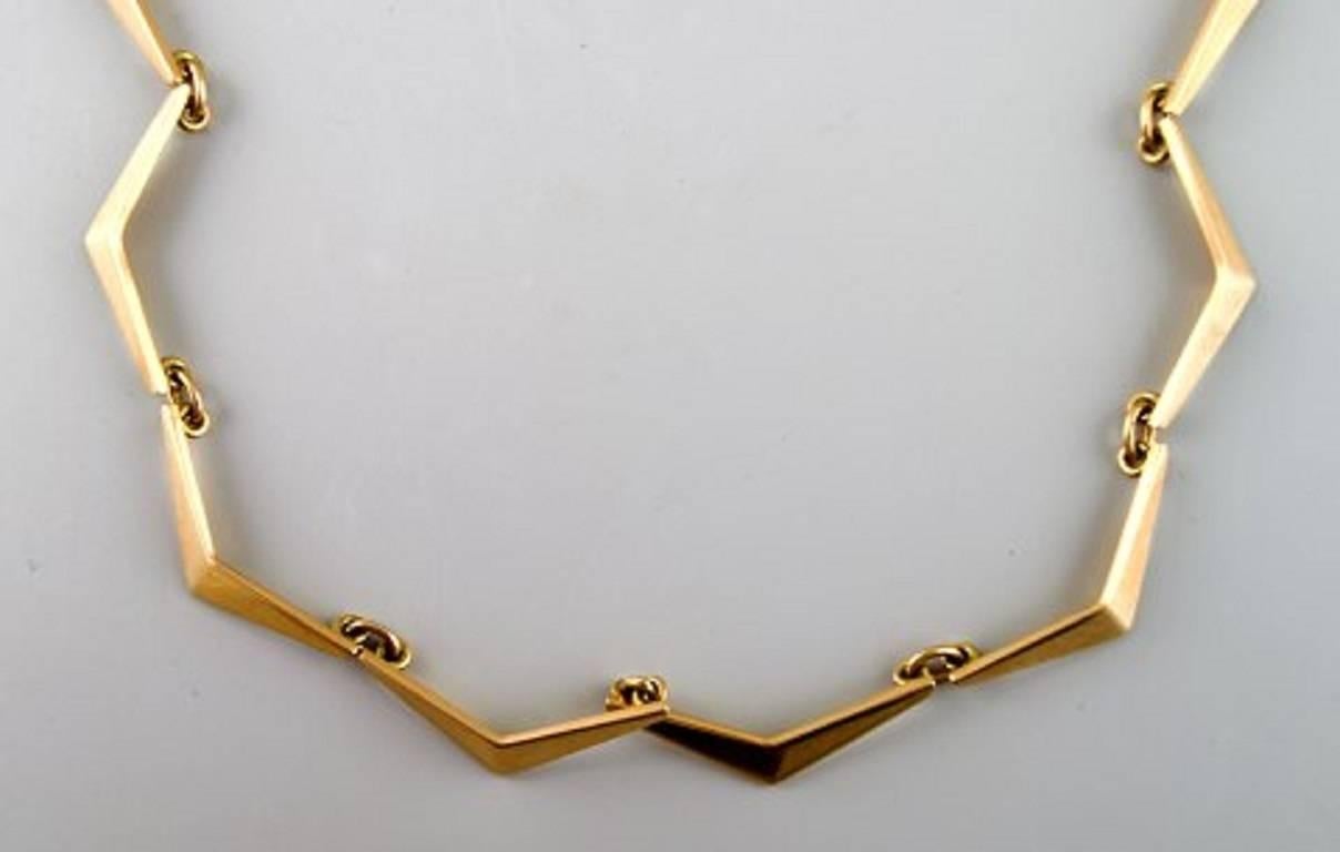 Just Andersen b. Qeqertarsuaq, Greenland 1884, d. Glostrup 1943.
Necklace in 18k. gold. 1940 s.
Amazing design.
Length 38.5 cm.
Weight 25 grams.
Marked.
In perfect condition