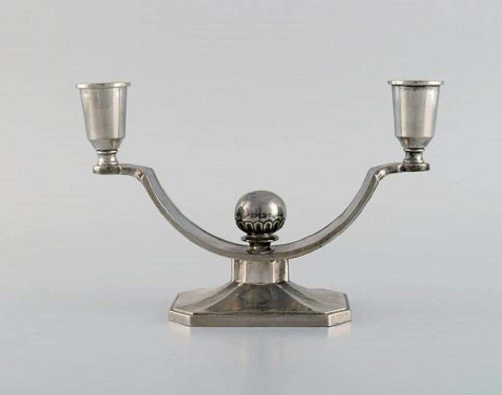 Just Andersen. A pair of pewter candlesticks. 1930s. 
Model number 1068.
Measures: 18.5 x 12 cm.
Stamped.
In excellent condition.