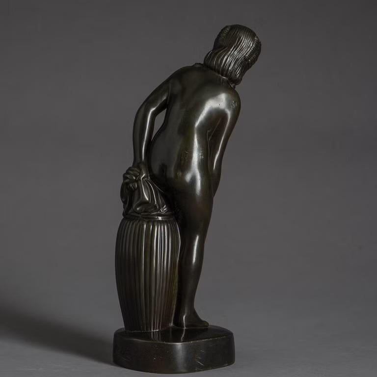 Just Andersen  sculpture of a naked women stand along a pillar. Art deco piece in great condition, around 1930's Denmark. Made in Disco metal invented by Just Andersen. 
