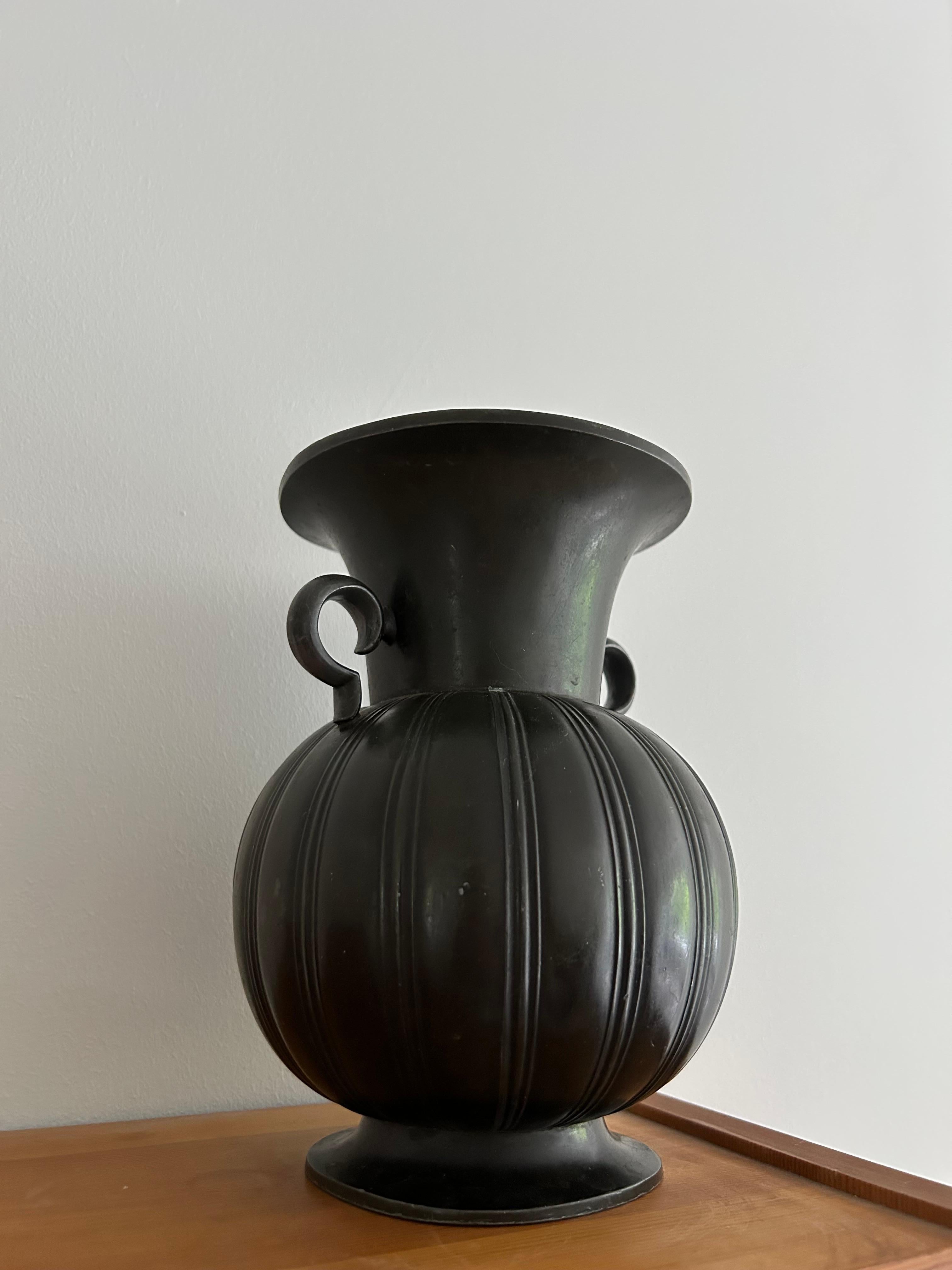 Rare and important Just Andersen Art Deco vase in patinaed disko metal made in Denmark in the 1930s.
The vase has model number 1925.

This vase is a perfect piece for any interior and will fit any type of interior from the traditional Scandinavian