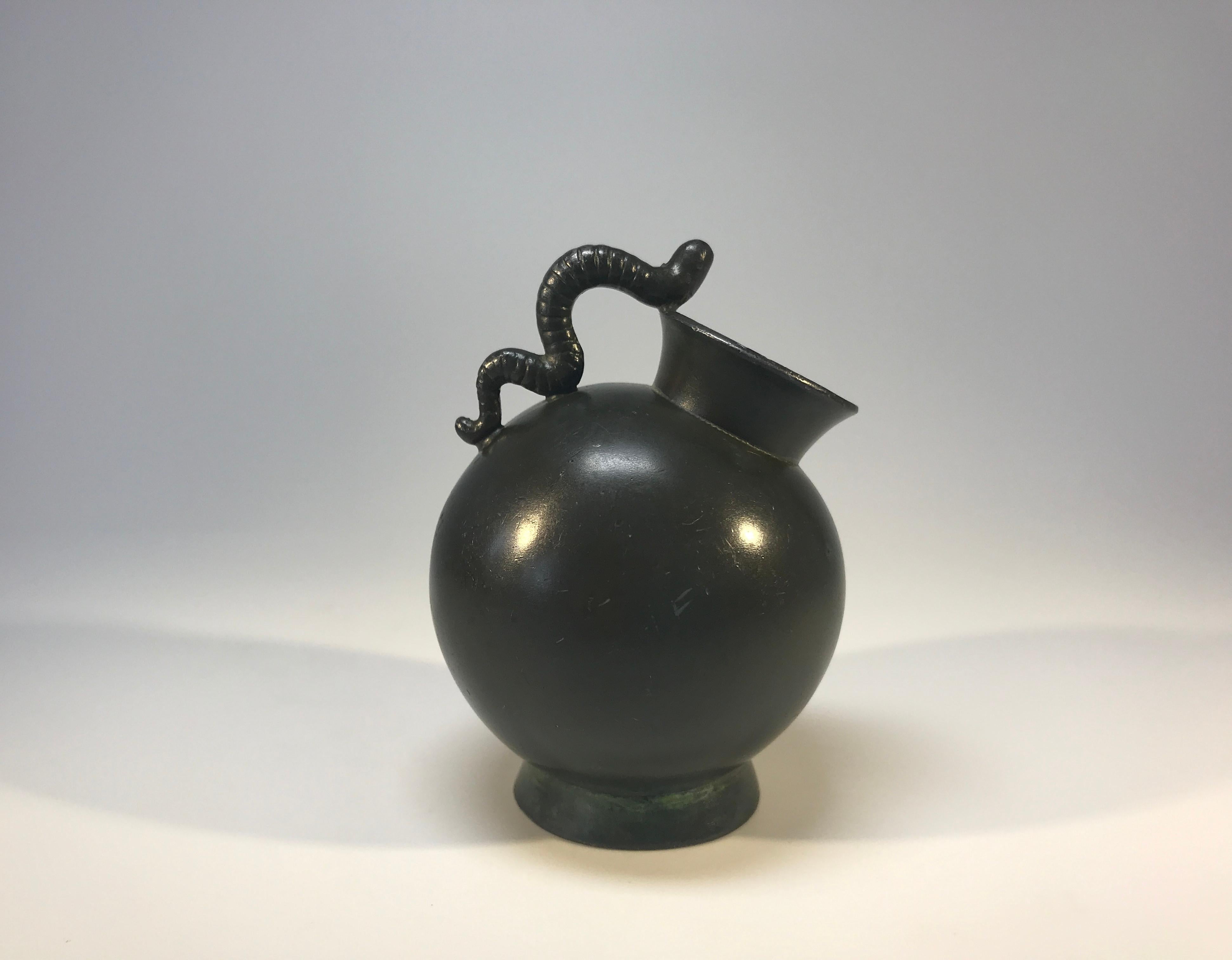 Just Andersen of Denmark, bronze patina Disko metal weighty inkwell with worm decoration handle,
circa 1930s
Stamped and numbered D160 on base
In very good condition and lovely dark patina.
               