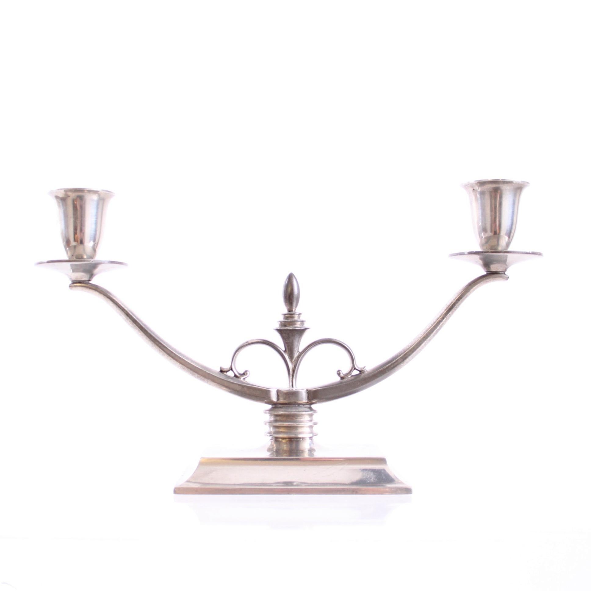 Just Andersen - Scandinavian Modern

A sculptural Just Andersen candelabra model 1453, two-armed, rectangular footed, in matte pewter.

Manufactured in Denmark 1933-35, stamped JUST 1453.

Excellent vintage condition and a beautiful