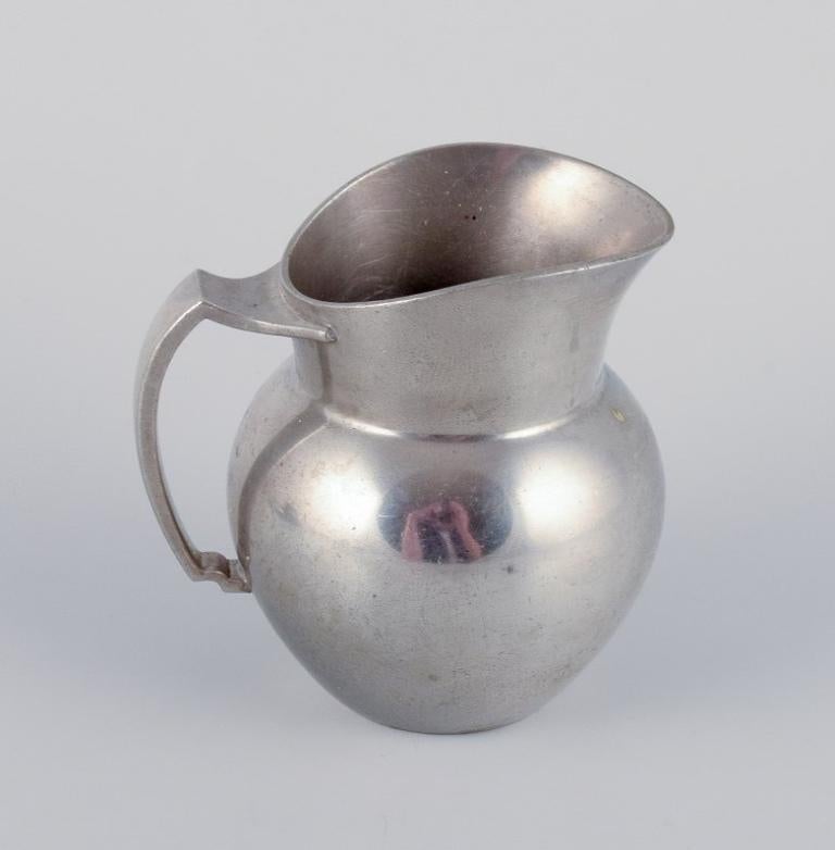 Mid-20th Century Just Andersen, creamer and sugar bowl on tray in pewter. 940s.  For Sale