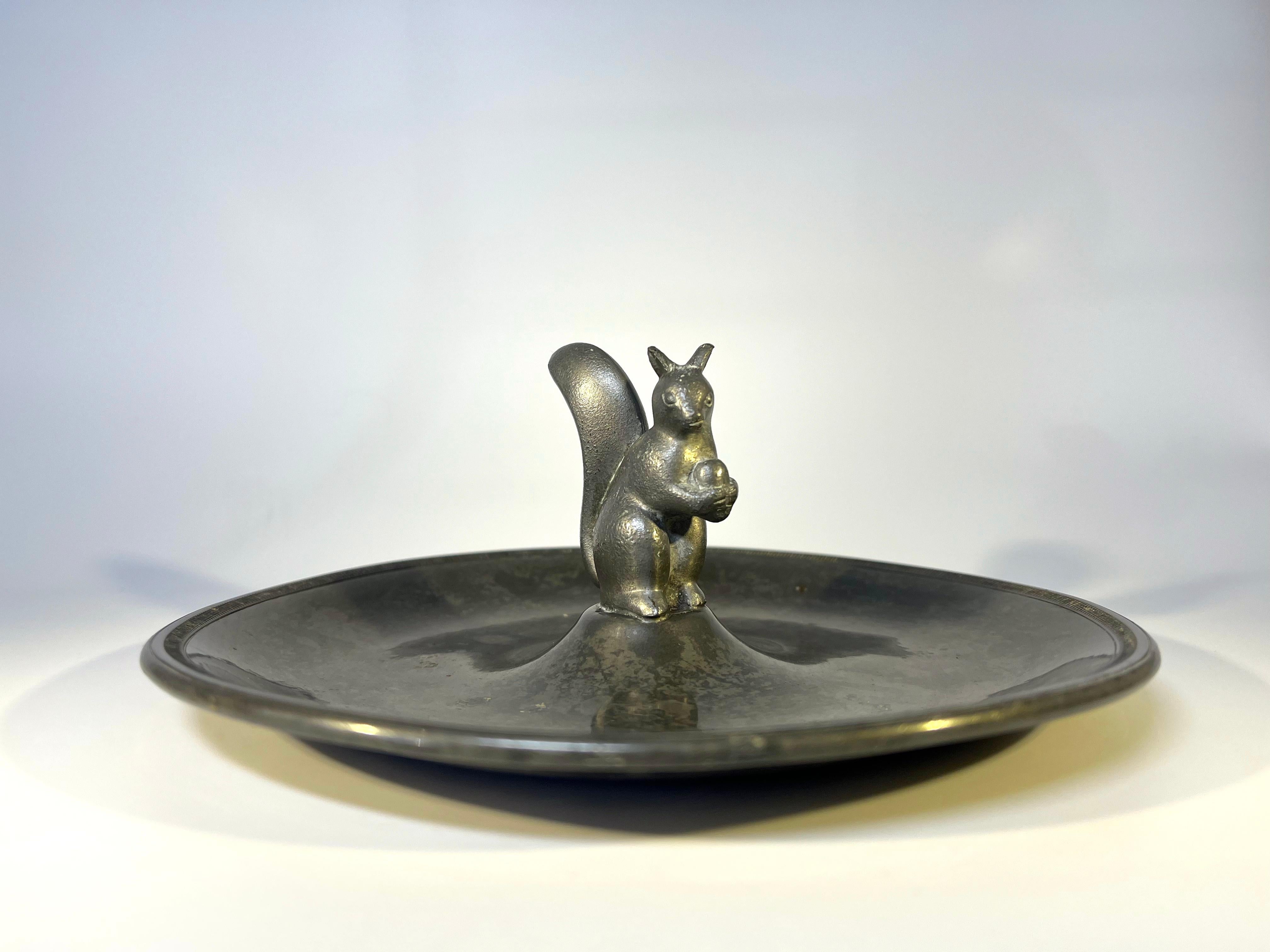 Just Andersen, Denmark 1930s Art Deco pewter stylised squirrel vide poche
Circa 1930's
Stamped and numbered 829 on base
Diameter 7 inch, Height 2.5 inch
Remarkably good condition and patina. Surface wear typical of age.